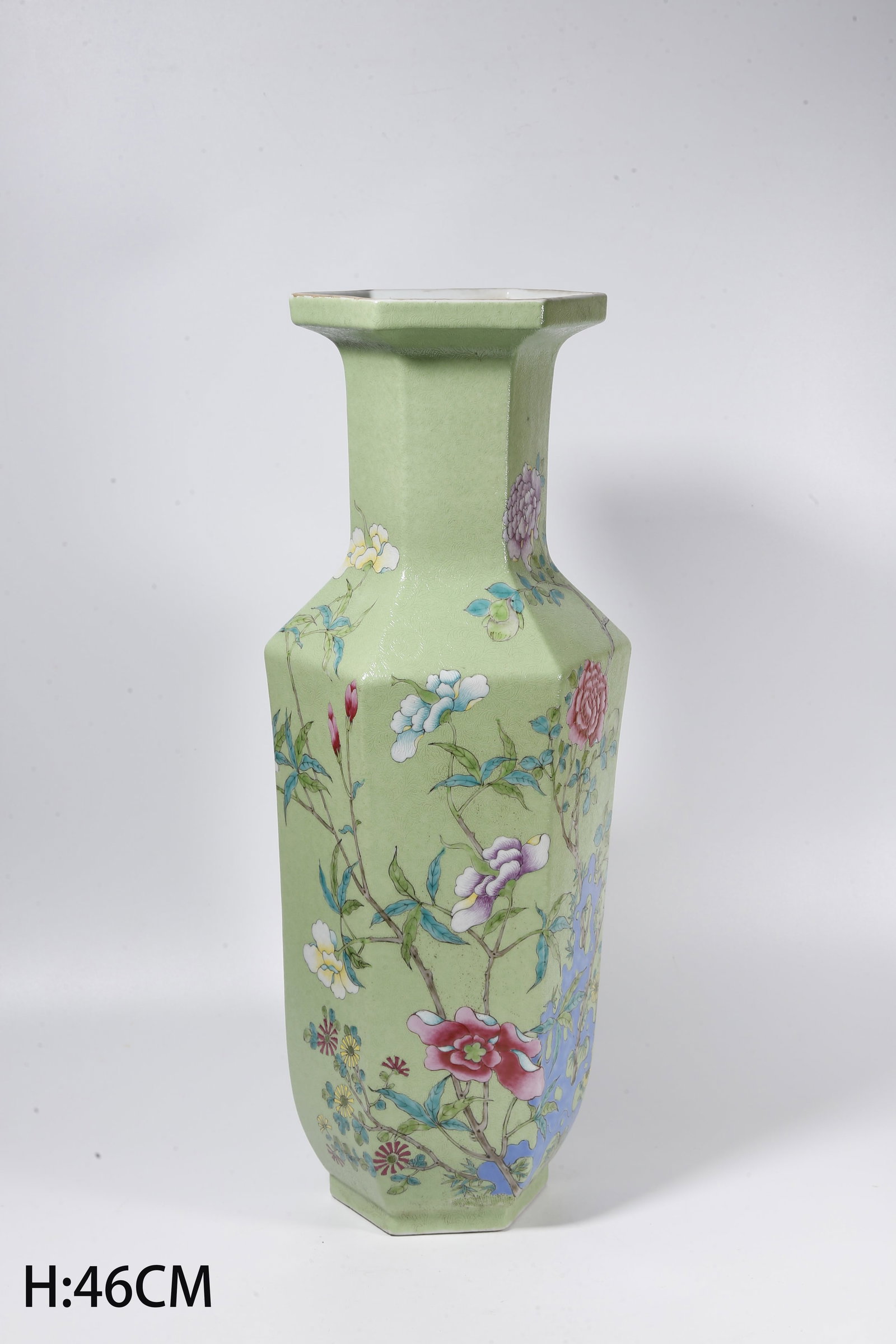 A TURQUOISE GREEN GLAZE HEXAGONAL PLATE-MOUTHED VASE WITH CARVED GROUND, ROCKERY AND FLORAL PATTERN (1 of 9)