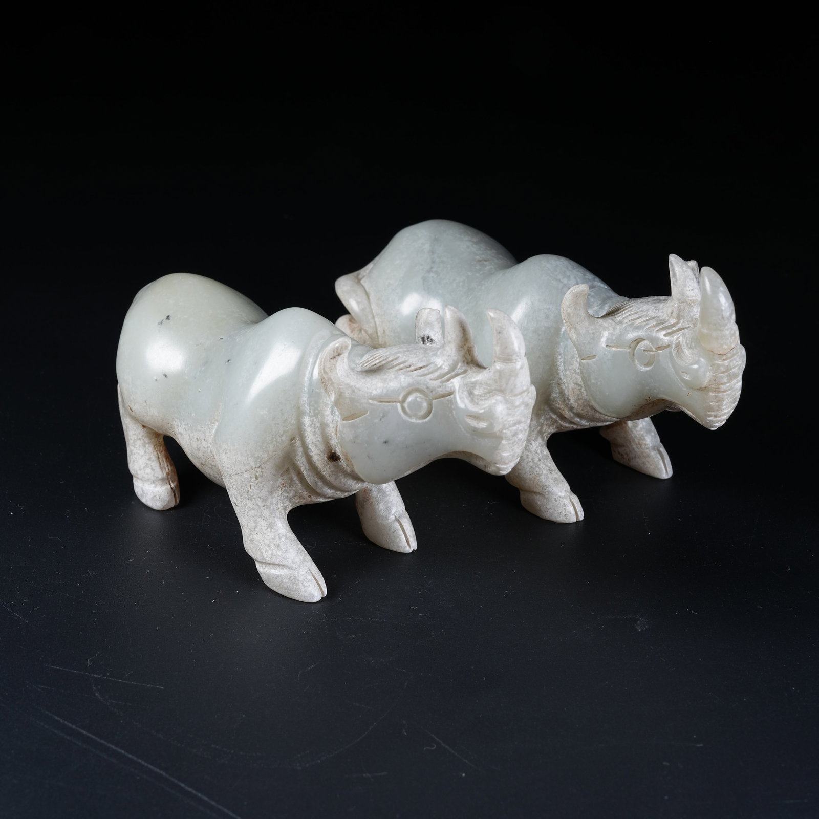 A SET OF ANCIENT JADE RHINOCEROS FIGURINES (1 of 9)