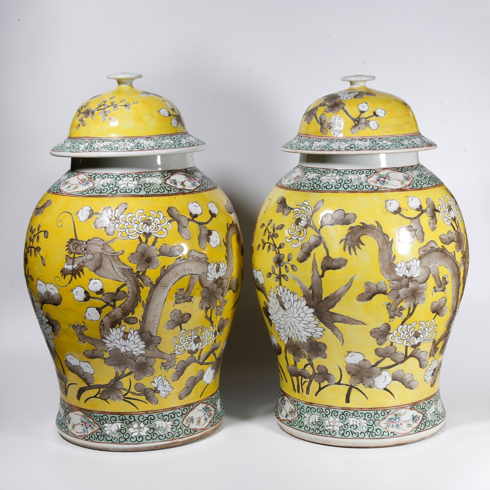 A PAIR OF GENERAL JARS WITH FAMILLE ROSE INTERTWINED DRAGON PATTERNS ON YELLOW GROUND (1 of 11)