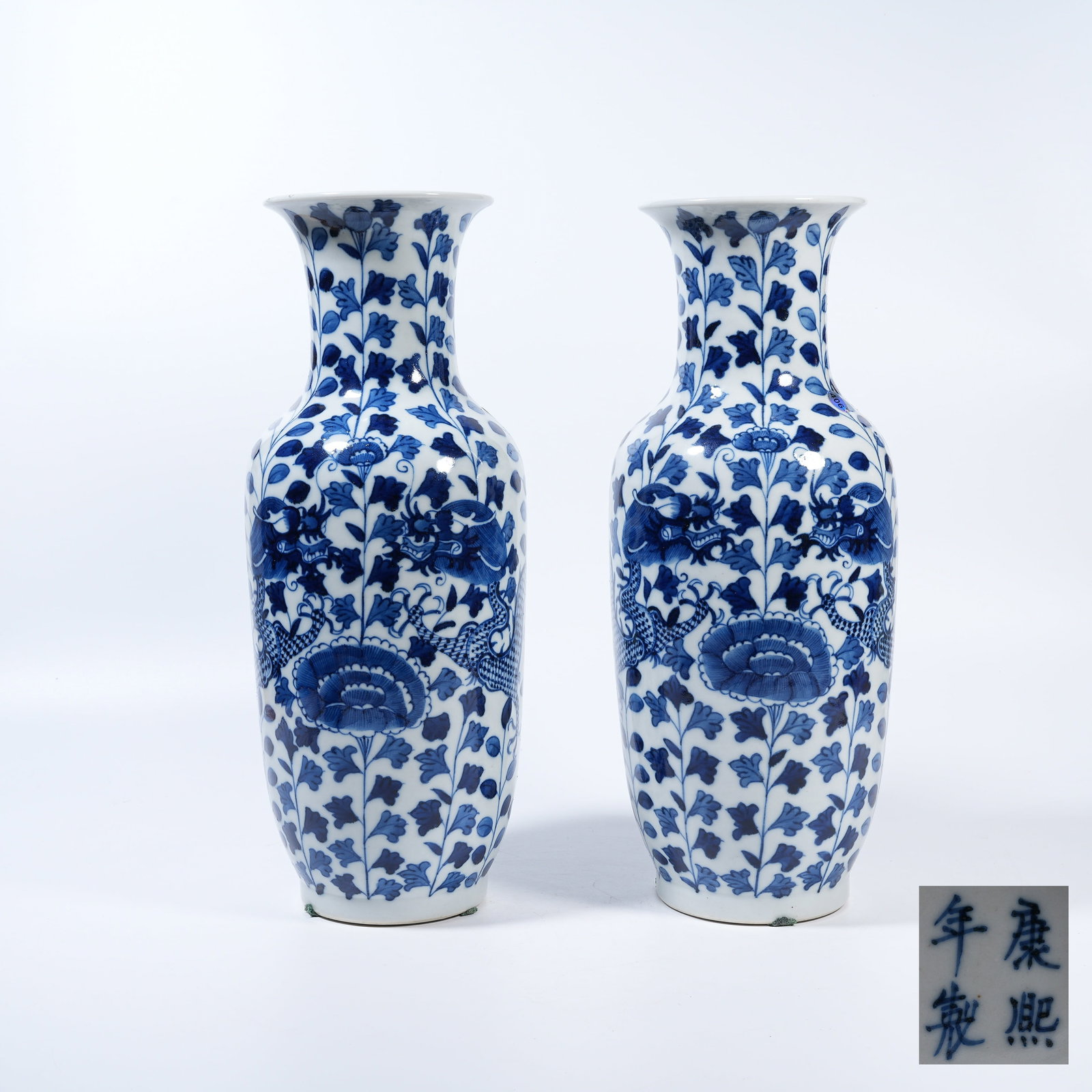 A SET OF BLUE AND WHITE VASES WITH INTERTWINED FLORAL DRAGON PATTERN: Set of Blue and White Vases with Intertwined Floral Dragon Pattern