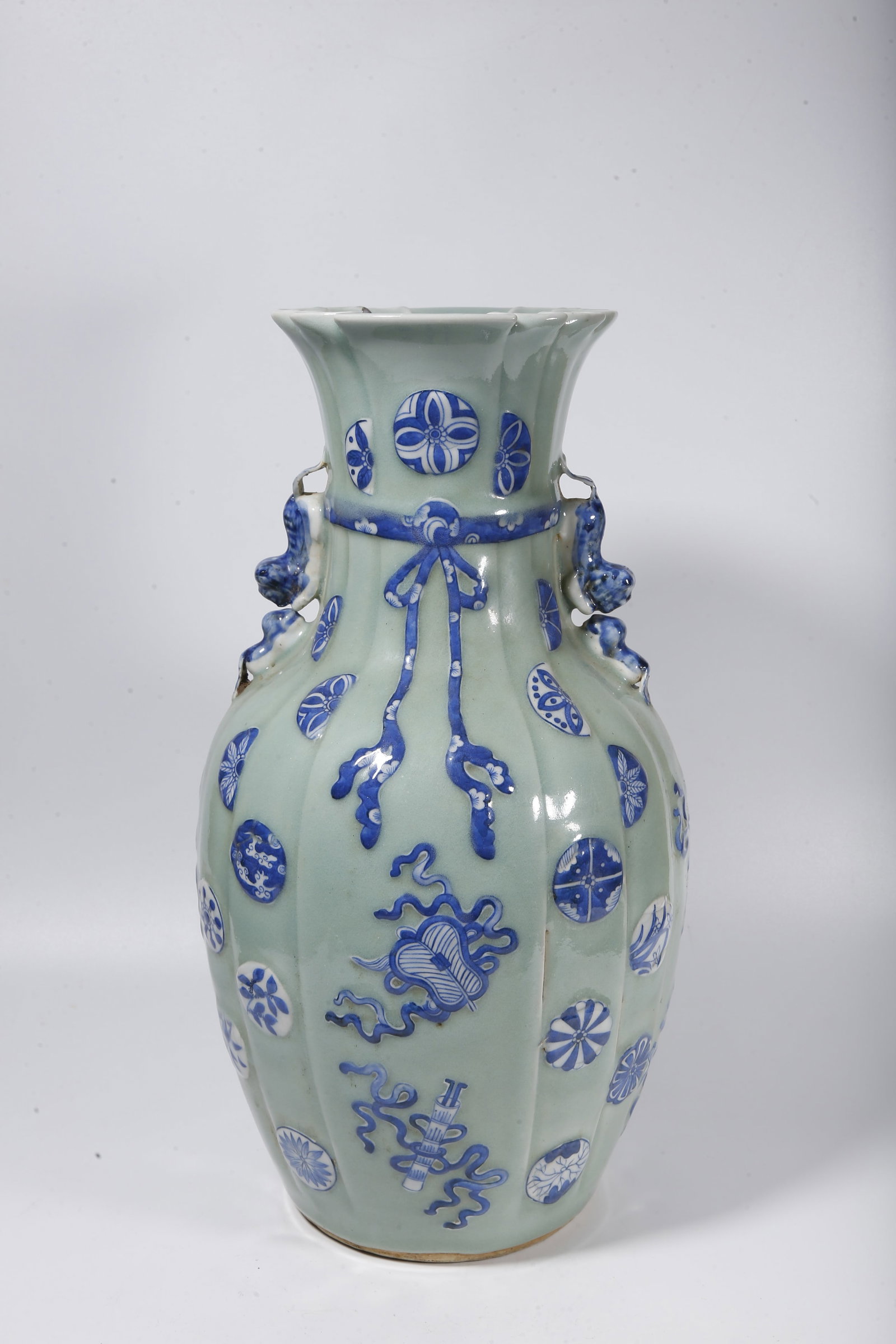 A PEA GREEN GLAZE BLUE AND WHITE APPRECIATION VASE WITH EIGHT TREASURES PATTERN (1 of 9)