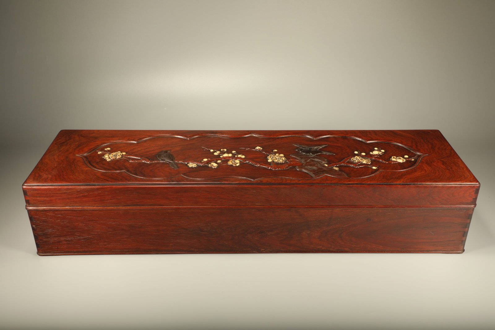 A LONG HUANGHUALI WOOD BOX INLAID WITH ZITAN WOOD AND CARVED MAGPIES PERCHING ON PLUM BLOSSOMS (1 of 7)