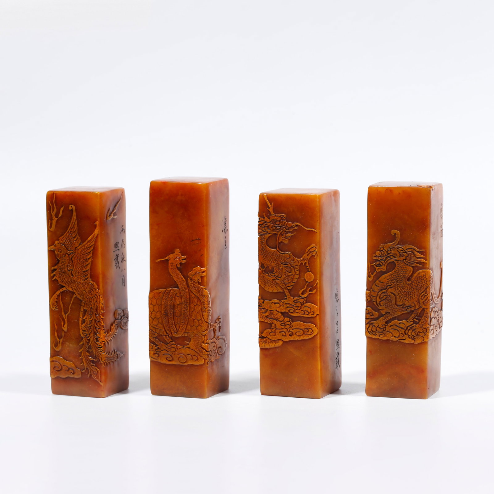 A SET OF SHOUSHAN TIANHUANG STONE SEALS CARVED WITH FOUR DIVINE BEASTS PATTERNS: Set of Shoushan Tianhuang Stone Seals Carved with Four Divine Beasts Patterns
