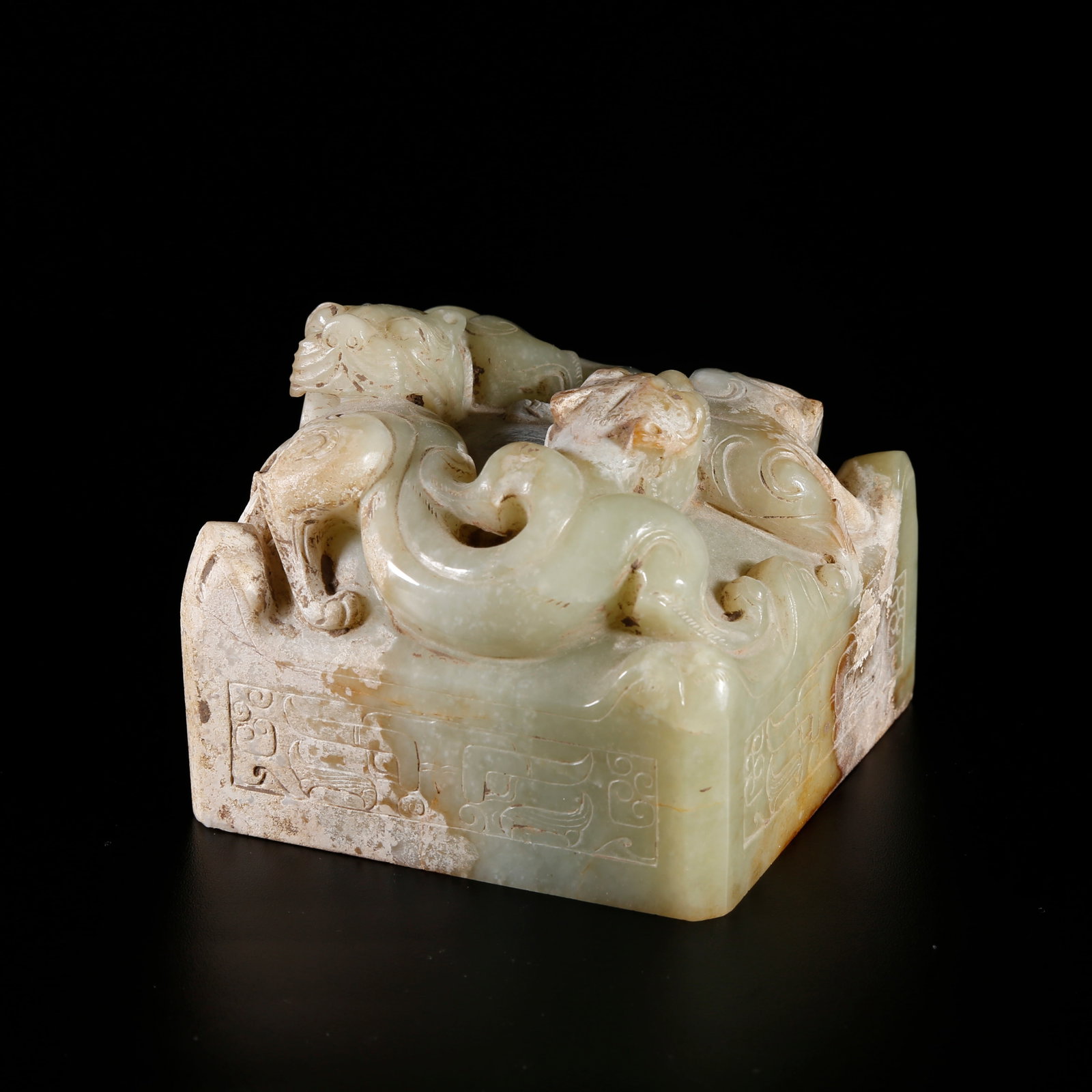 A HETIAN JADE SEAL CARVED WITH DRAGON PATTERN: Hetian Jade Seal Carved with Dragon Pattern