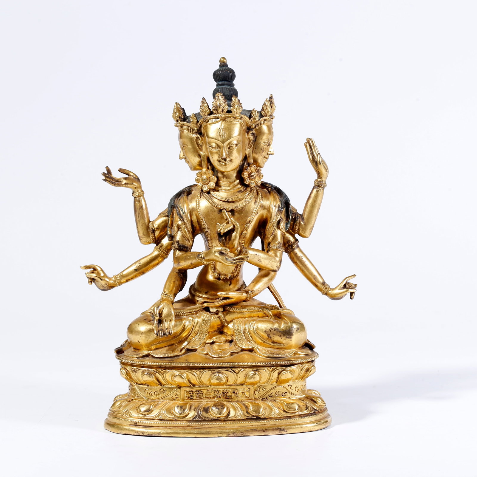 A GILT-BRONZE SIX-ARMED BUDDHA FIGURE: Gilt-Bronze Six-Armed Buddha Figure