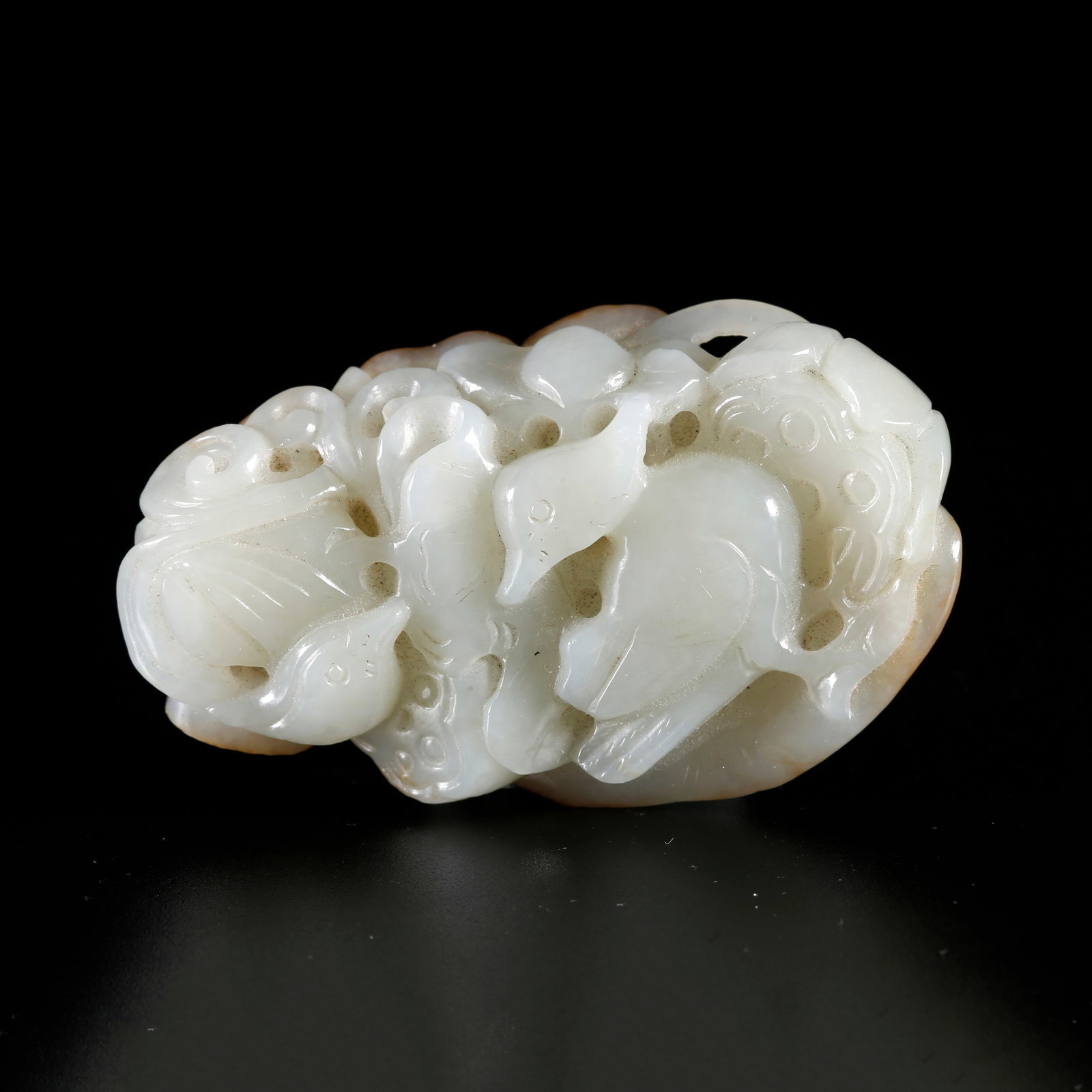 A HETIAN JADE ORNAMENT CARVED WITH BEAST PATTERN (1 of 9)