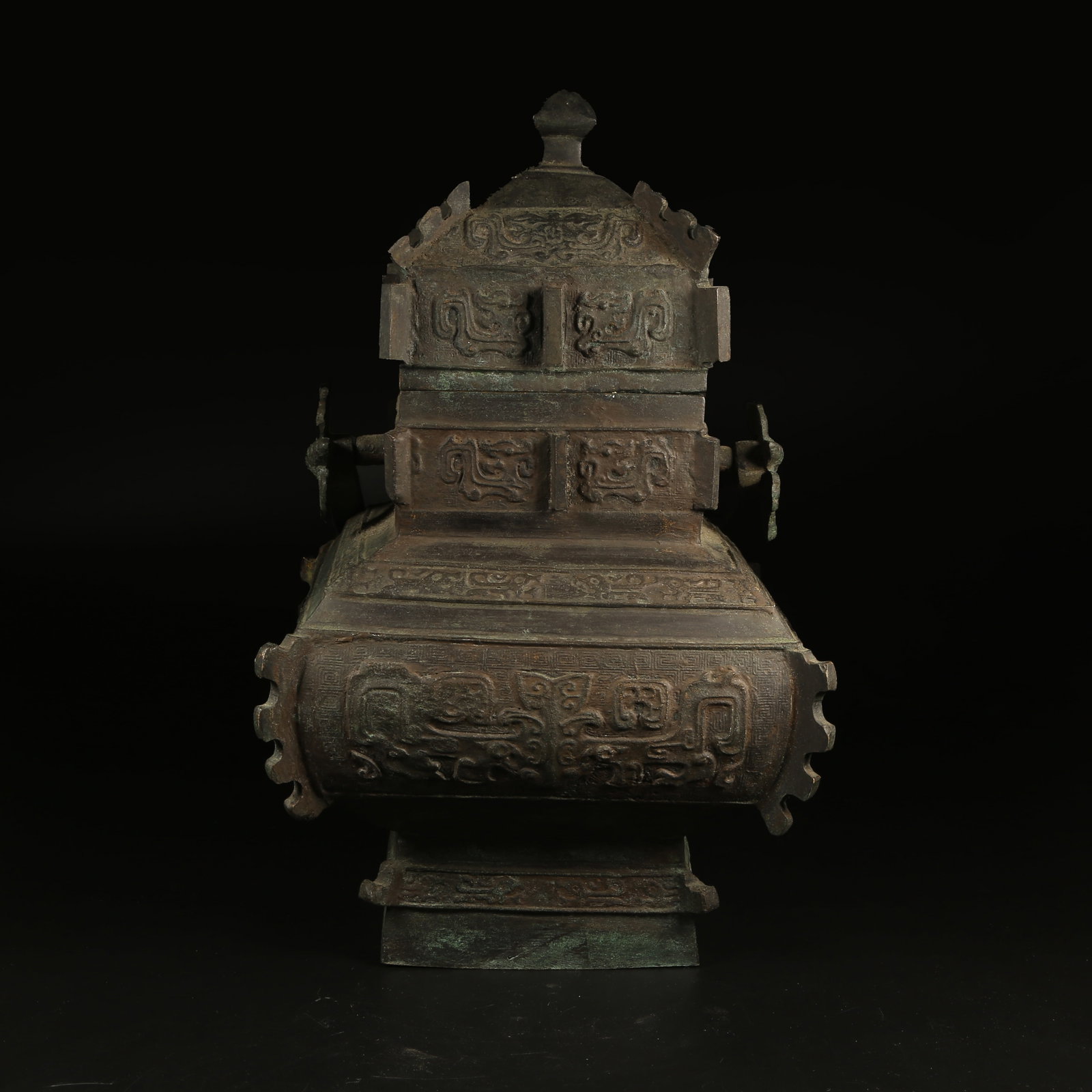 A BRONZE TRIPOD TEAPOT WITH TAOTIE MASK DESIGN: Bronze Tripod Teapot with Taotie Mask Design