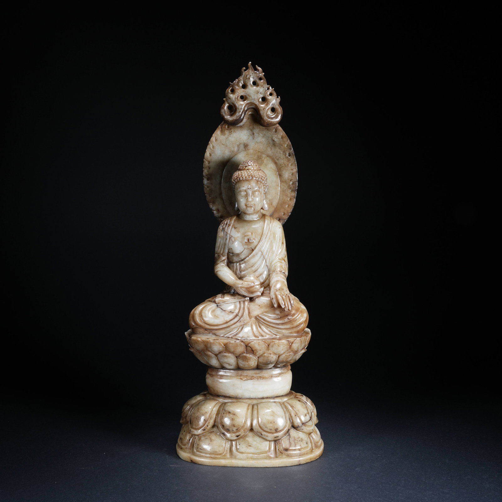 A SEATED SAKYAMUNI STATUE IN HETIAN JADE: Seated Sakyamuni Statue in Hetian Jade