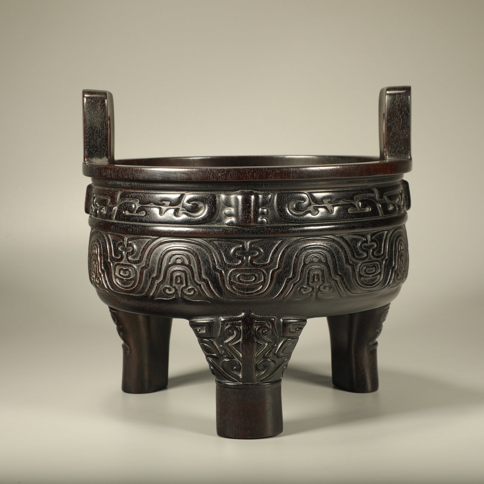 A THREE-LEGGED ZITAN INCENSE CENSER CARVED WITH BEAST PATTERNS: Three-legged Zitan Incense Censer Carved with Beast Patterns