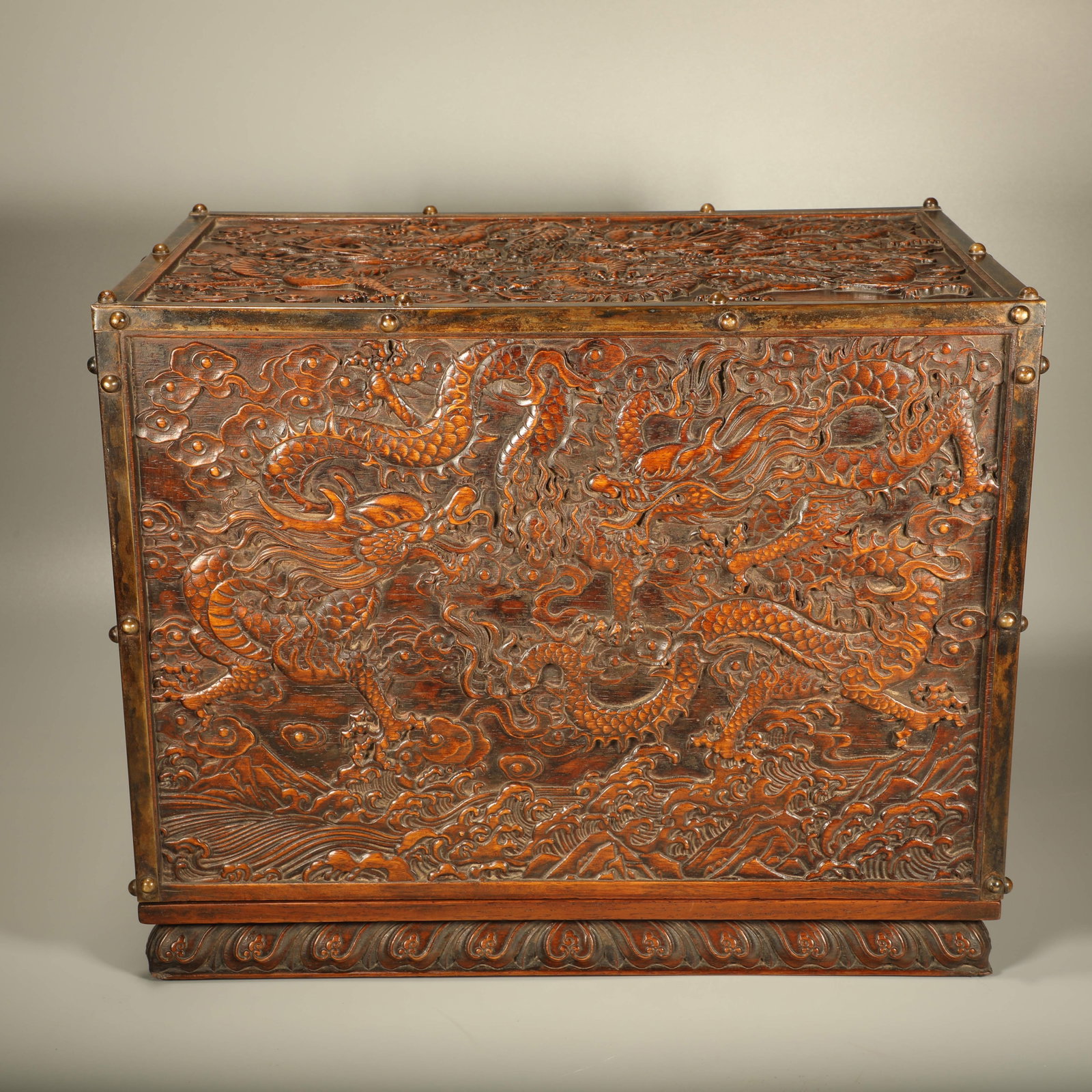 A HUANGHUALI CHEST CARVED WITH DRAGON AND HUNDRED LONGEVITY CHARACTER PATTERNS (1 of 6)