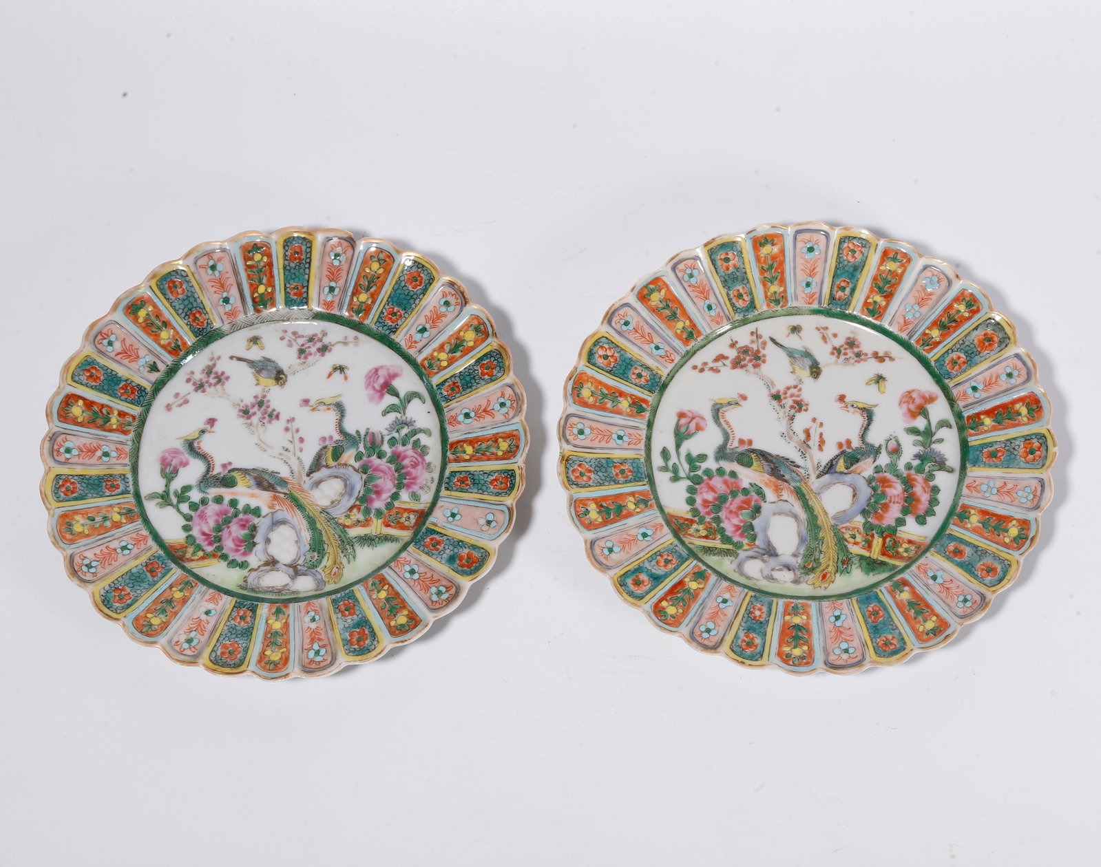 A PAIR OF CANTON ENAMEL PLATES WITH FLOWER AND PEACOCK MOTIFS: Pair of Canton Enamel Plates with Flower and Peacock Motifs