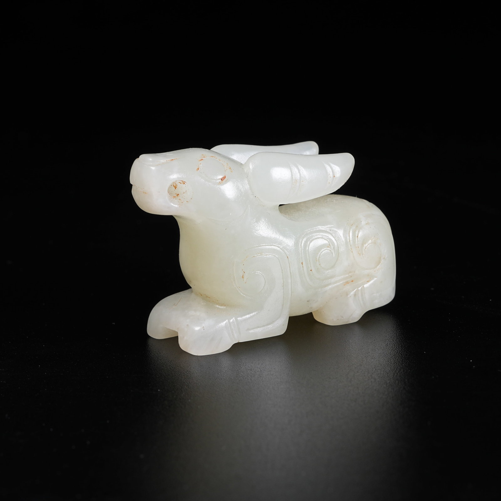 A RECUMBENT RABBIT PENDANT OF ANCIENT JADE (1 of 8)