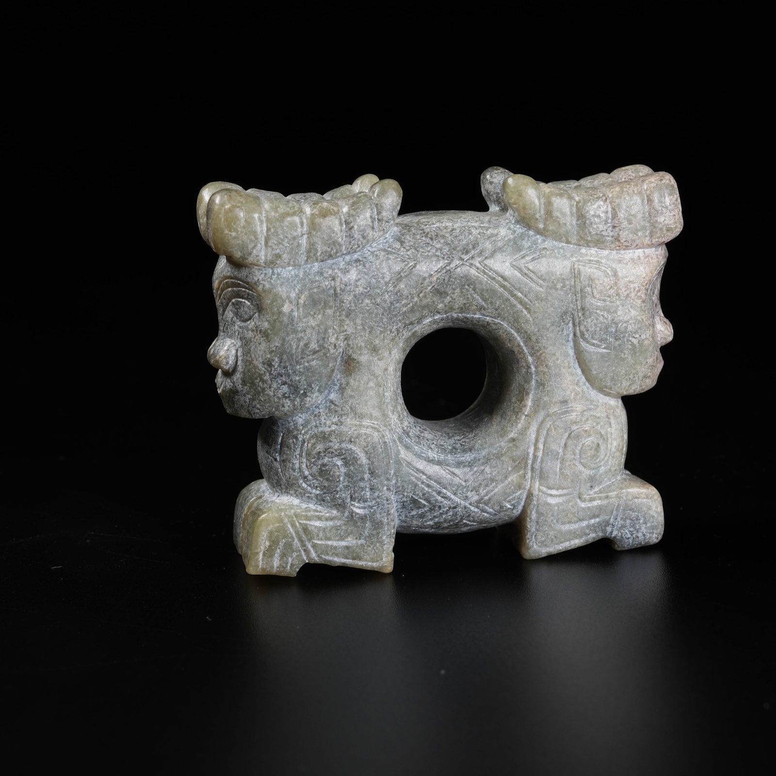 A ANCIENT JADE BI DISC CARVED WITH TWIN DIVINE FIGURES: Ancient Jade Bi Disc Carved with Twin Divine Figures