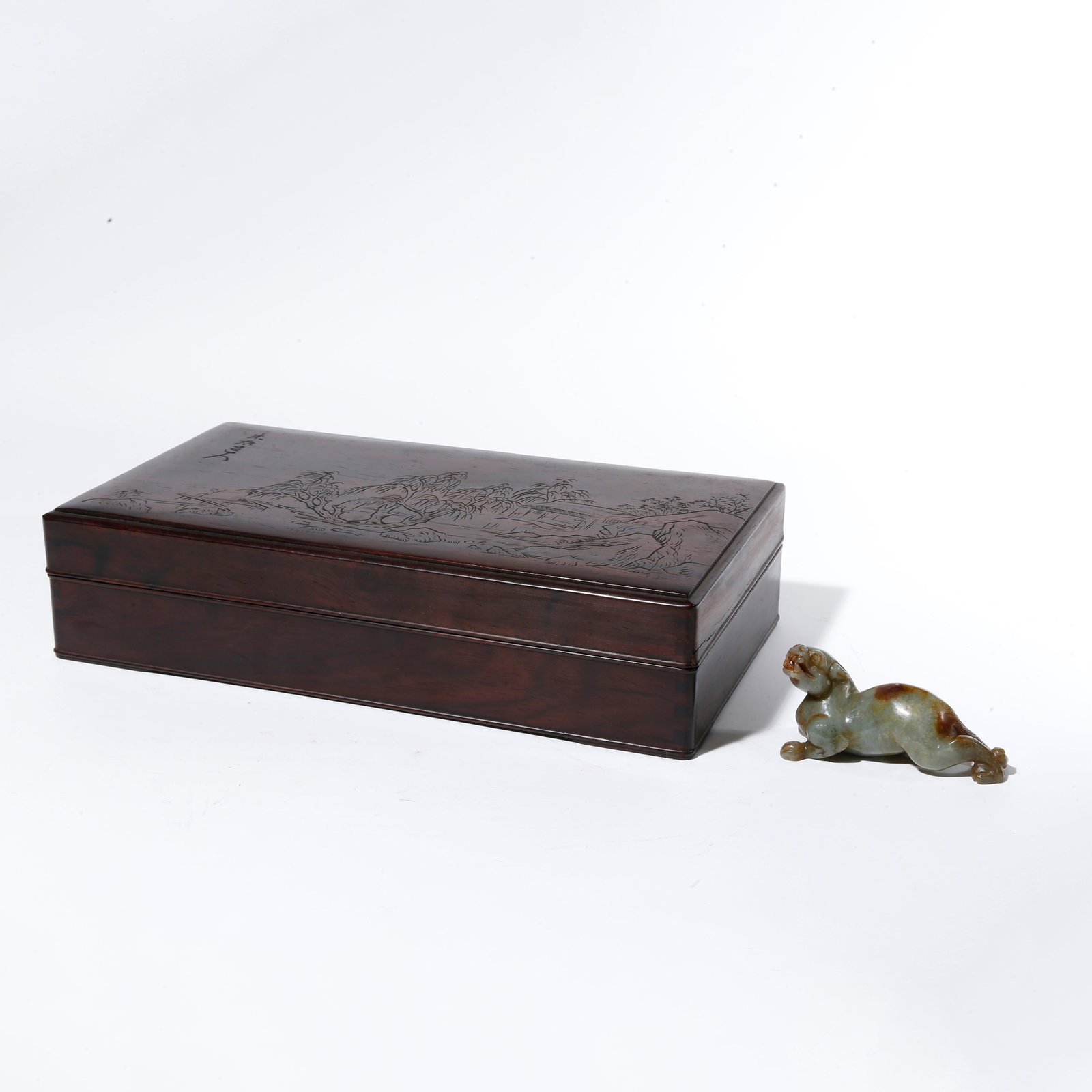 A HETIAN JADE CARVED ORNAMENT IN BEAST SHAPE: Hetian Jade Carved Ornament in Beast Shape