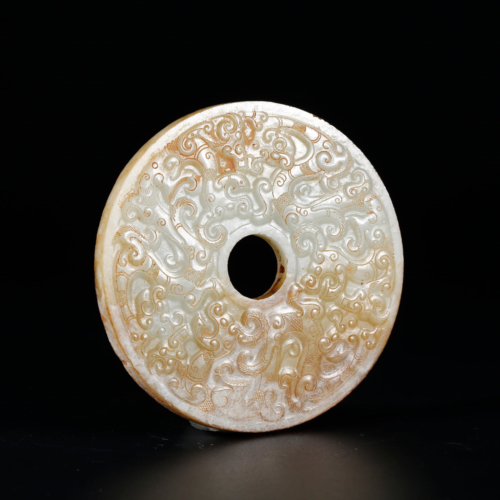 A ANCIENT JADE BI DISC CARVED WITH BEAST MOTIFS: Ancient Jade Bi Disc Carved with Beast Motifs