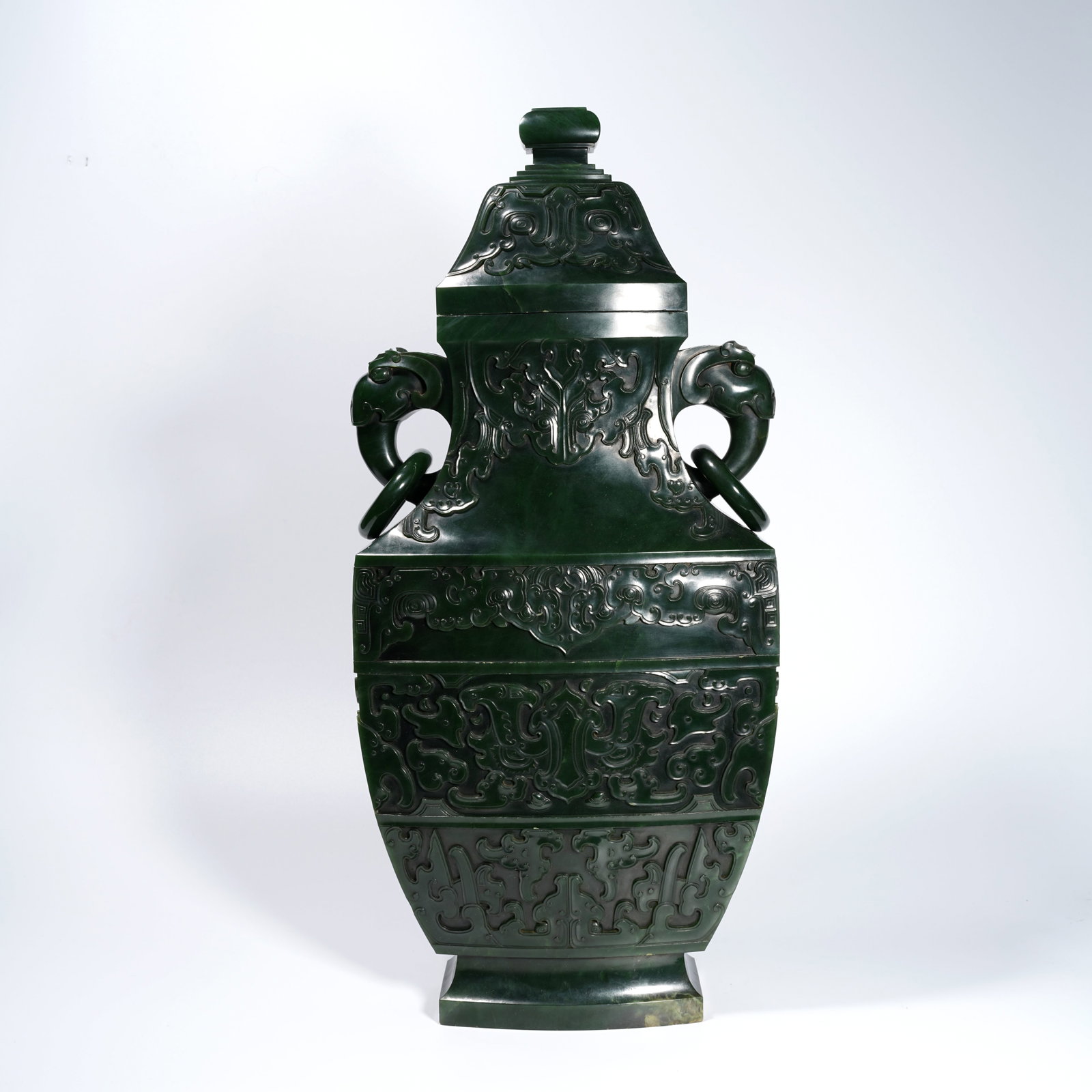 A HETIAN SPINACH-GREEN JADE CARVED BEAST-MASK MOTIF COVERED VASE WITH DOUBLE ELEPHANT HANDLES (1 of 11)