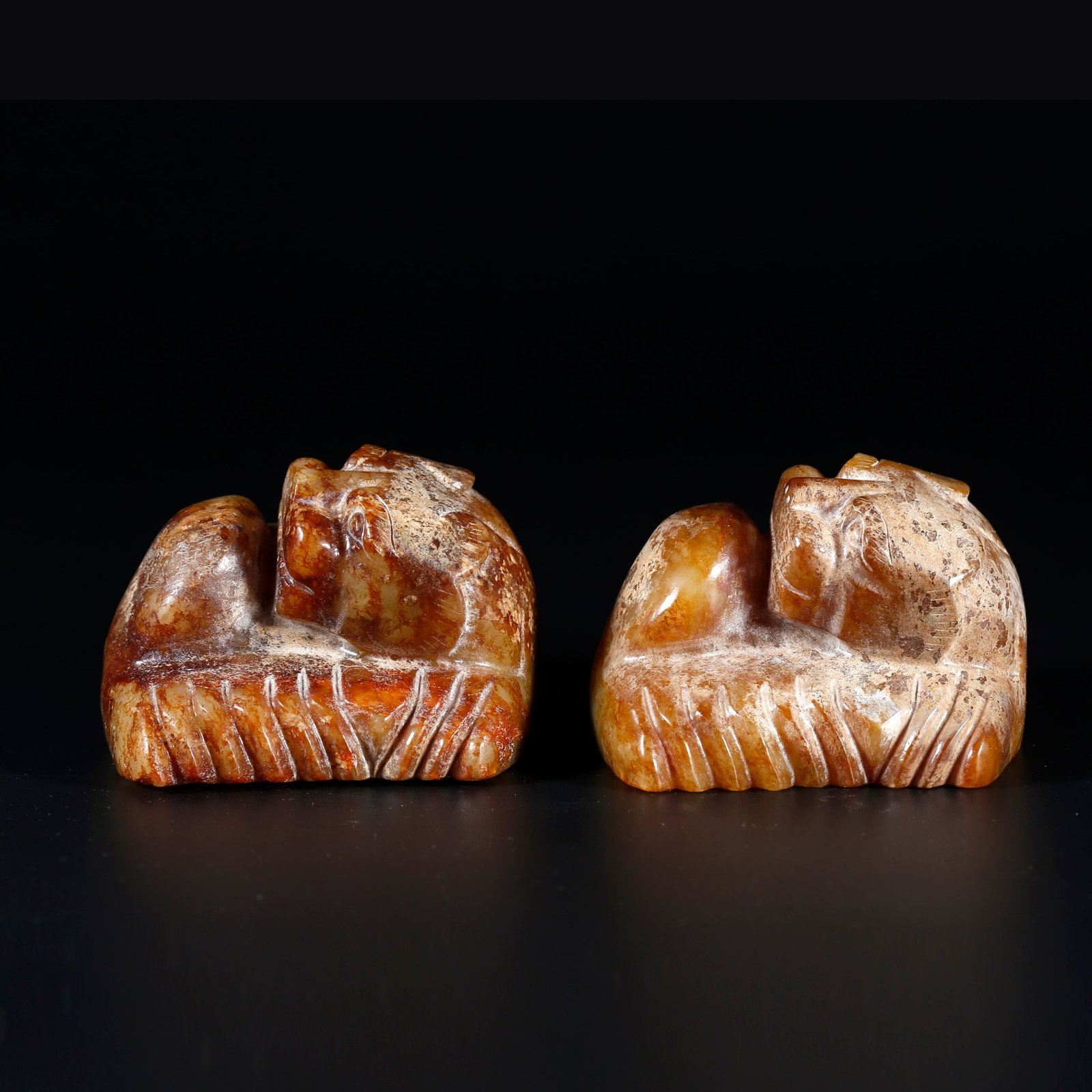 A PAIR OF ANCIENT JADE BEAST-SHAPED PAPER WEIGHTS (1 of 9)
