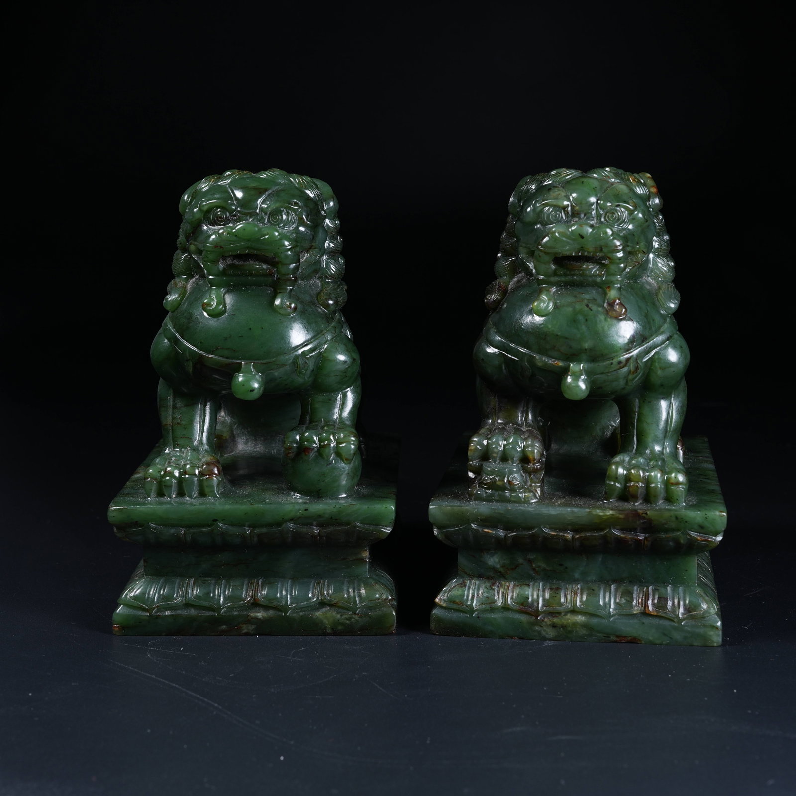A SET OF SEATED LION ORNAMENTS OF HETIAN JASPER: Set of Seated Lion Ornaments of Hetian Jasper