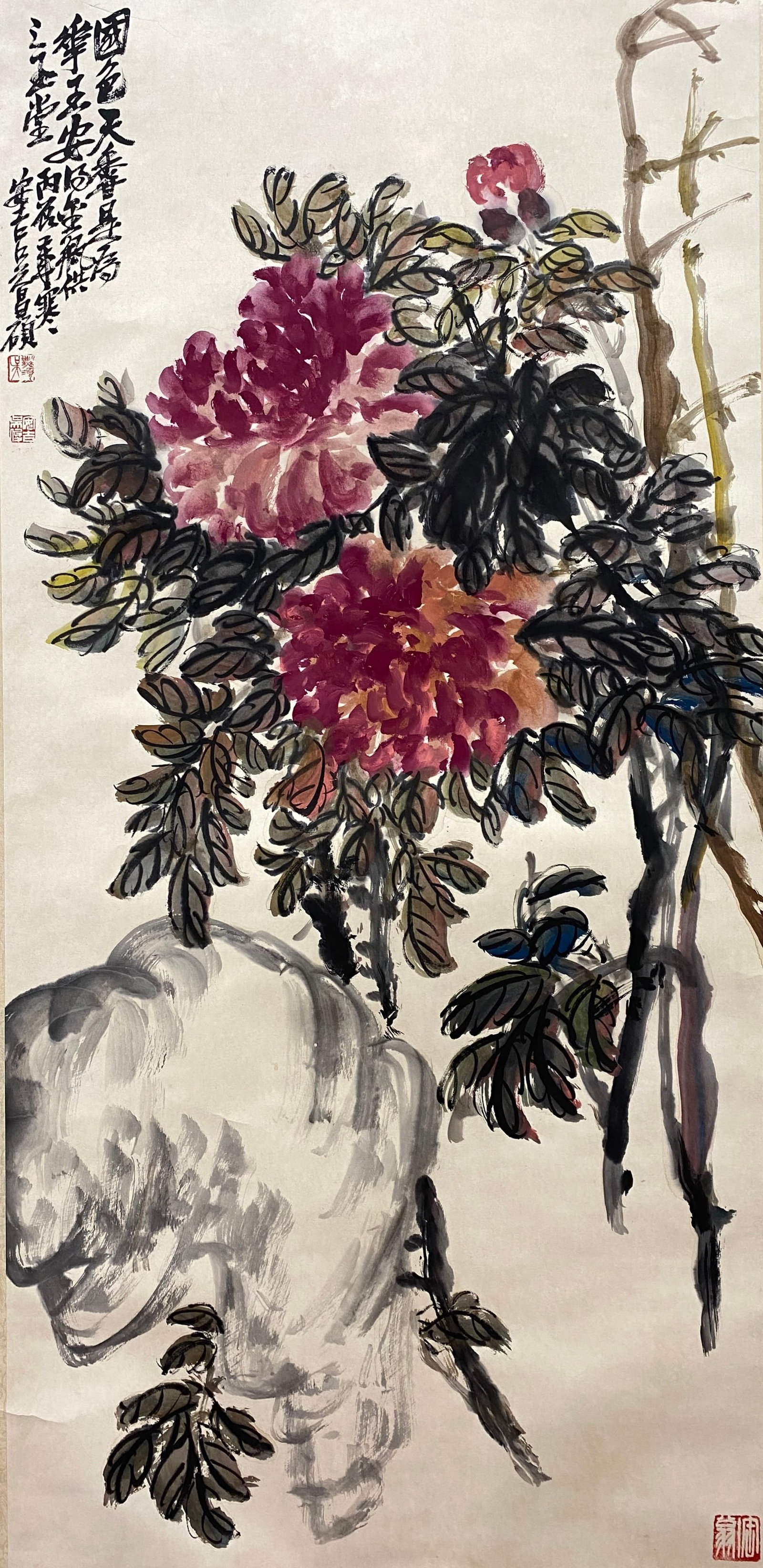 A VERTICAL SCROLL OF PEONIES AND RUGGED ROCKS ON PAPER BY WU CHANGSHUO.吳昌碩: Vertical Scroll of Peonies and Rugged Rocks on Paper by Wu Changshuo.吳昌碩