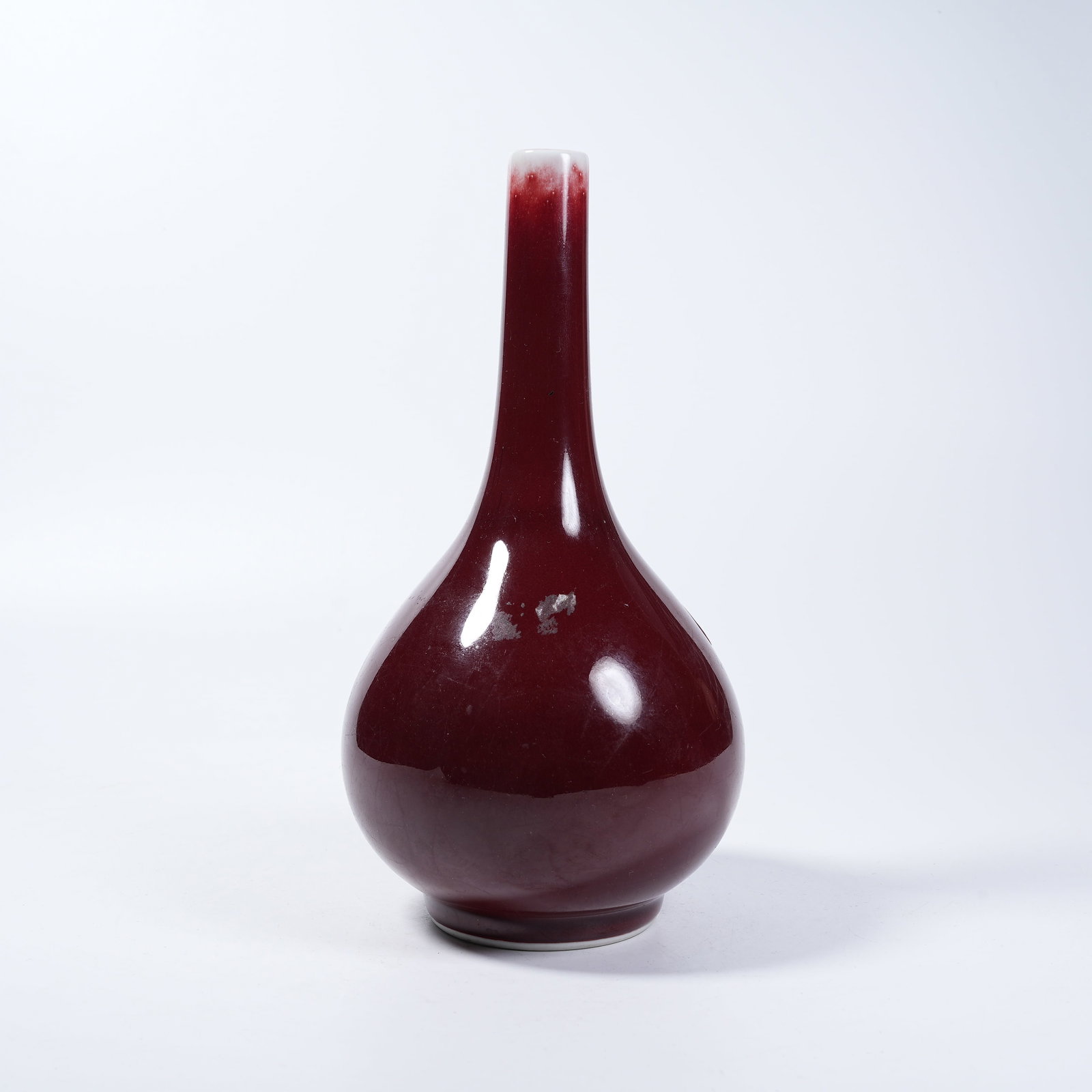 A SACRIFICIAL RED GLAZE LONG-NECK VASE: Sacrificial Red Glaze Long-neck Vase