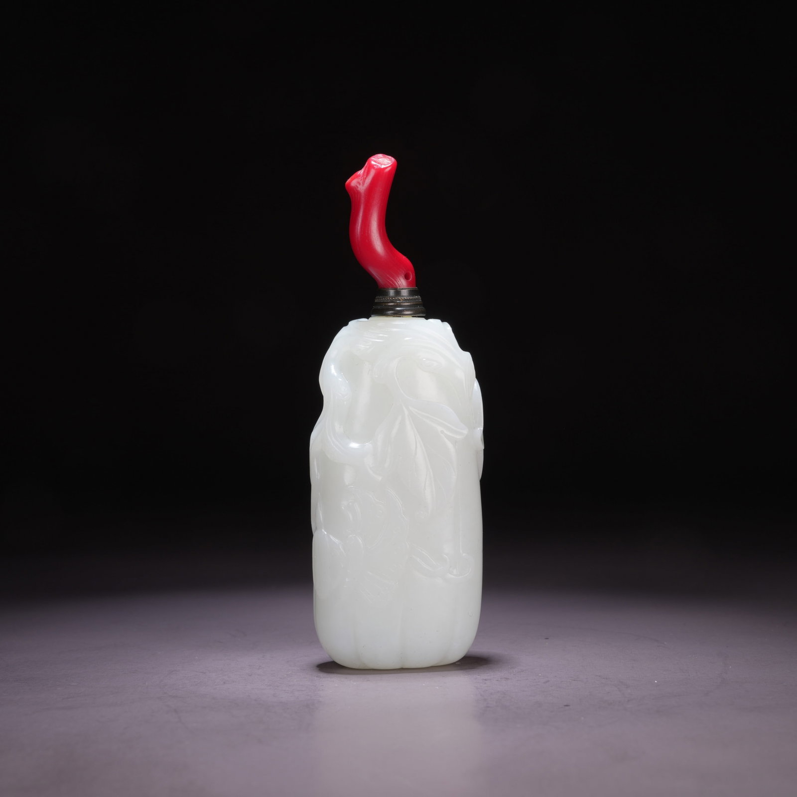 A HETIAN WHITE JADE SNUFF BOTTLE WITH FLORAL MOTIFS (1 of 9)