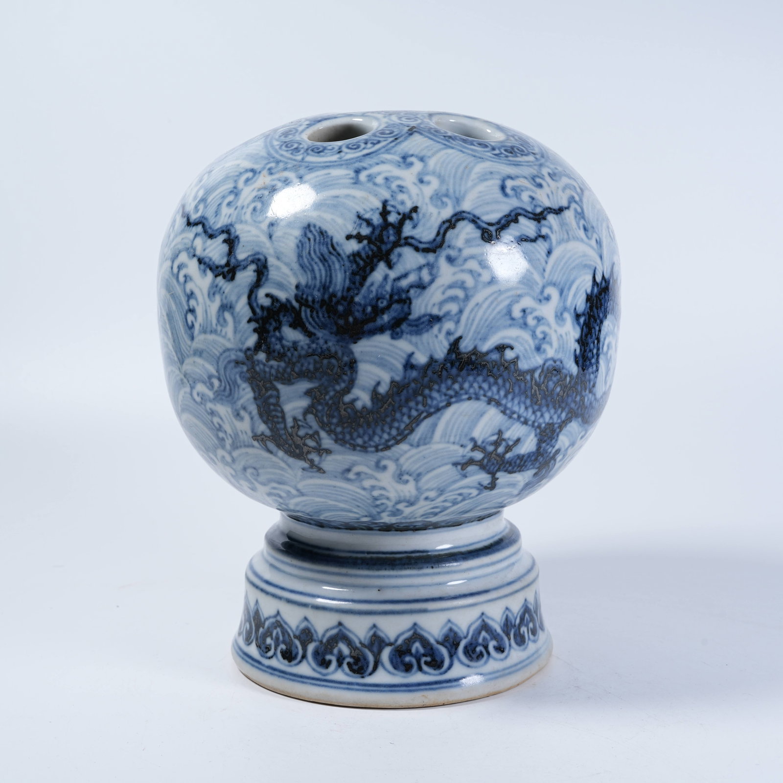 A FLOWER HOLDER WITH BLUE AND WHITE SEA WATER DRAGON MOTIFS (1 of 9)