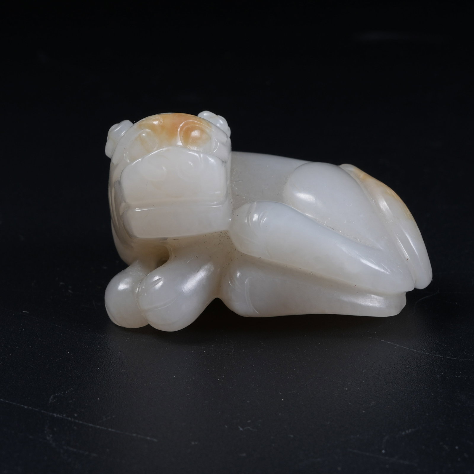 A AUSPICIOUS BEAST ORNAMENT OF HETIAN JADE (1 of 8)
