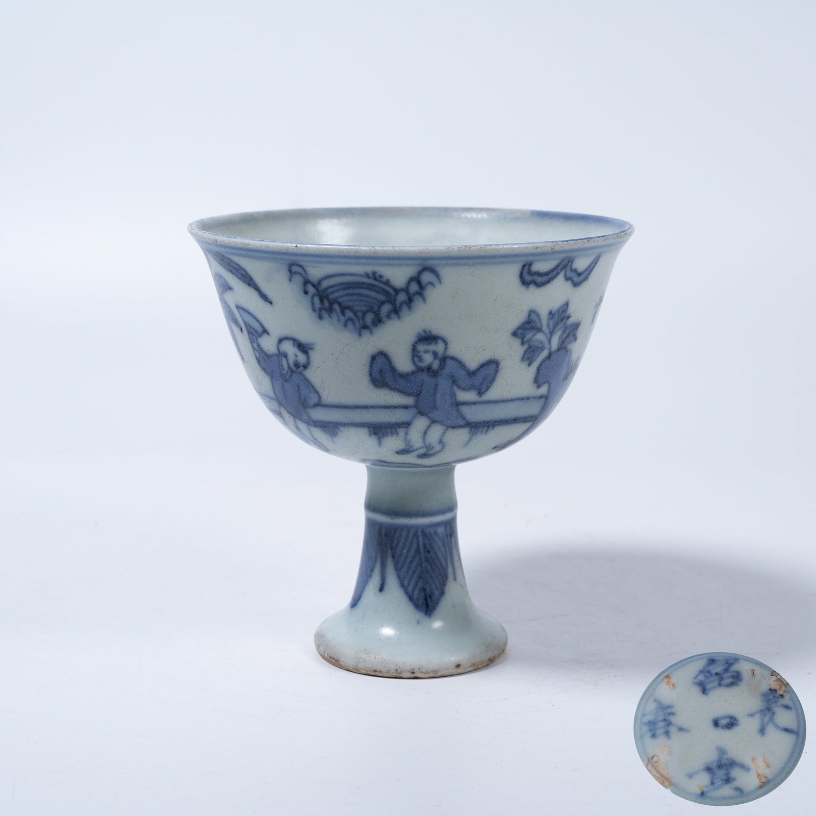 A BLUE AND WHITE STEM CUP WITH CHILDREN AT PLAY SCENES: Blue and White Stem Cup with Children at Play Scenes