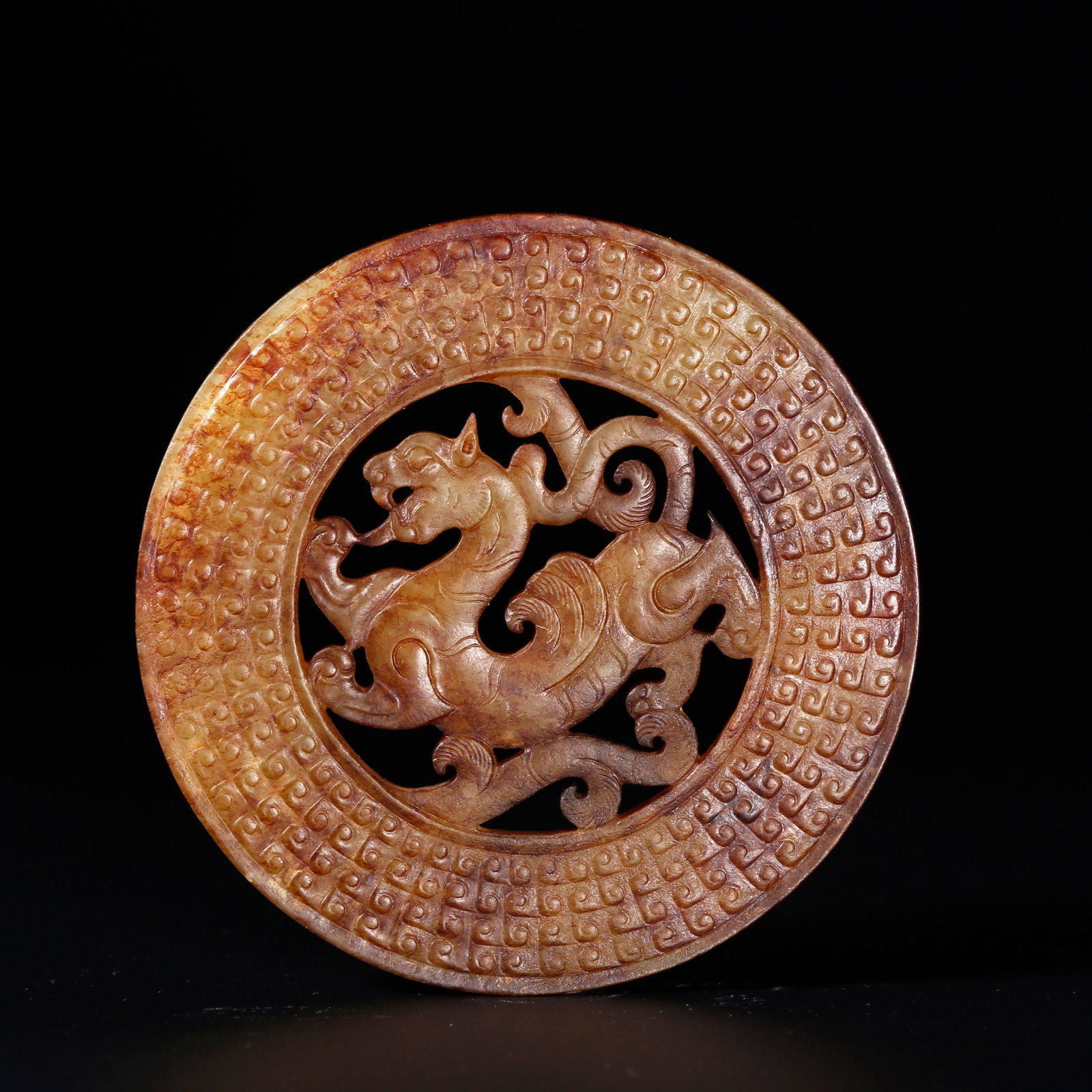 A ANCIENT JADE BI DISC CARVED WITH WHITE TIGER PATTERNS: Ancient Jade Bi Disc Carved with White Tiger Patterns