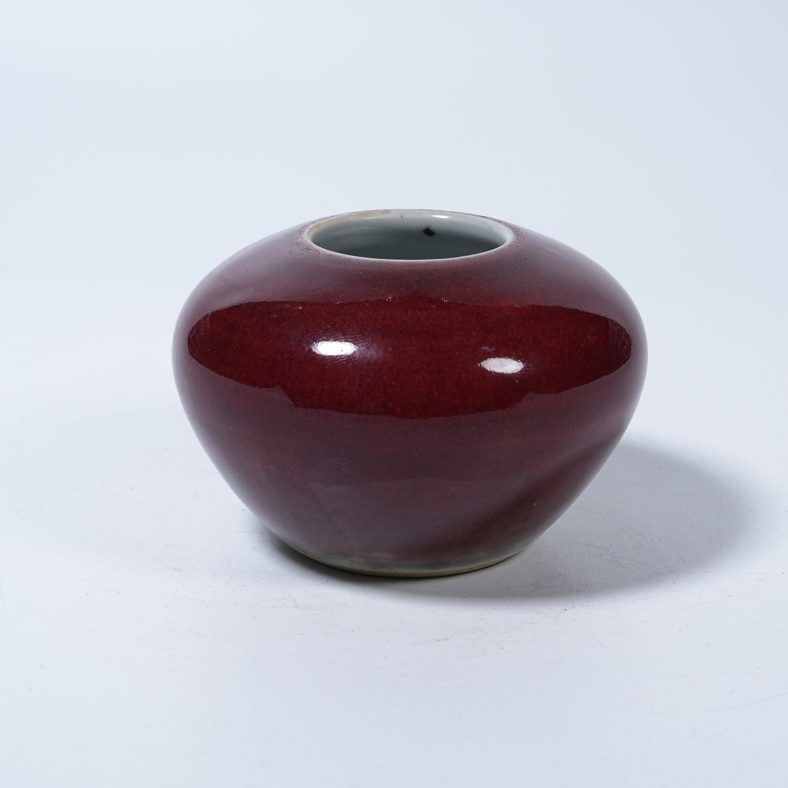 A SACRIFICIAL RED GLAZE WATER WASHER: Sacrificial Red Glaze Water Washer