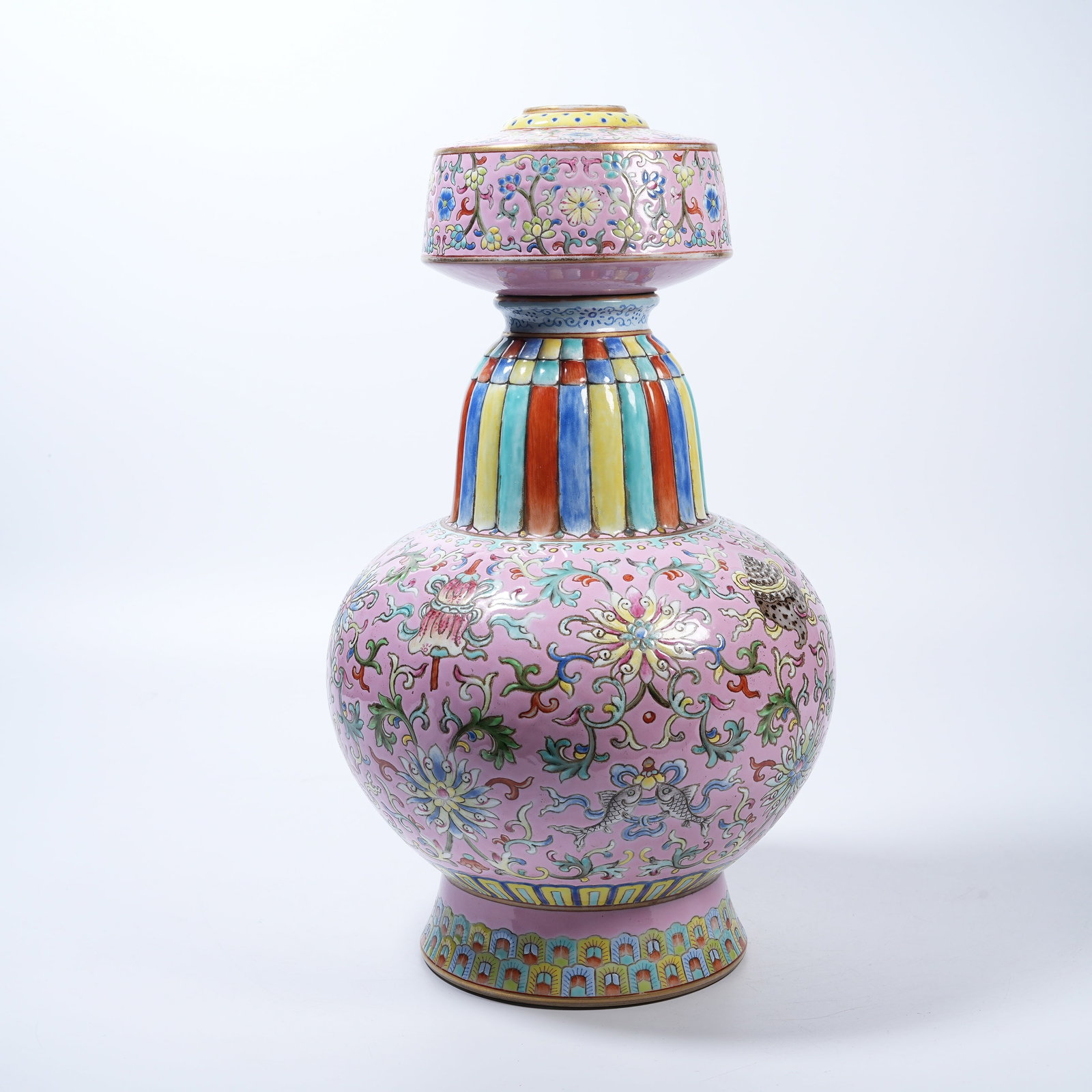 A PINK GROUND PENBA POT WITH INTERLOCKING LOTUS SUPPORTING EIGHT TREASURES IN FAMILLE ROSE (1 of 9)