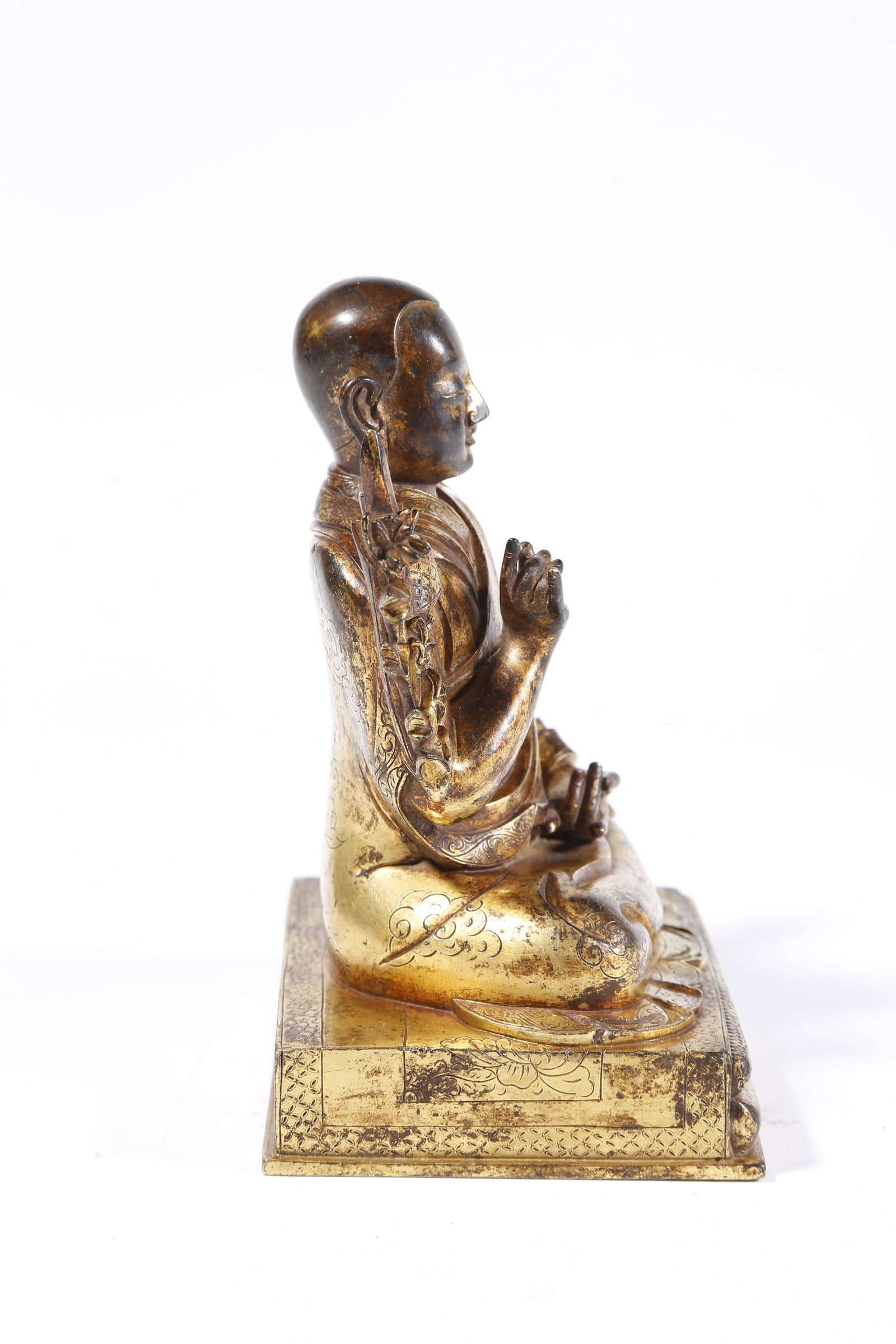 A GILT-BRONZE LAMA FIGURE - 8