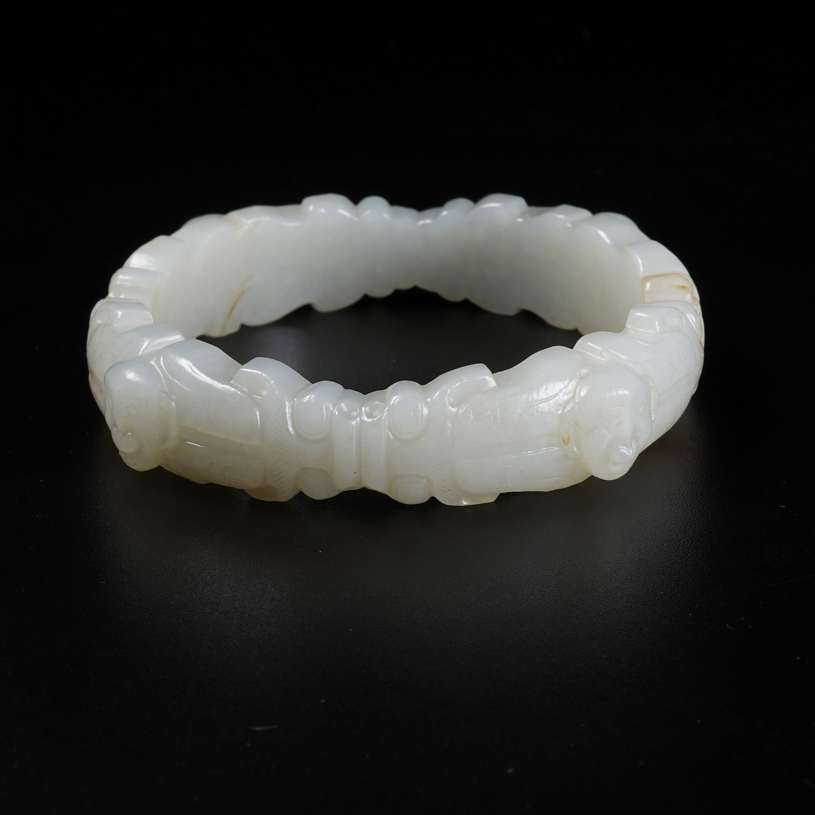 A BRACELET WITH DRAGON HEAD AND DIVINE FIGURE PATTERNS OF ANCIENT JADE (1 of 8)