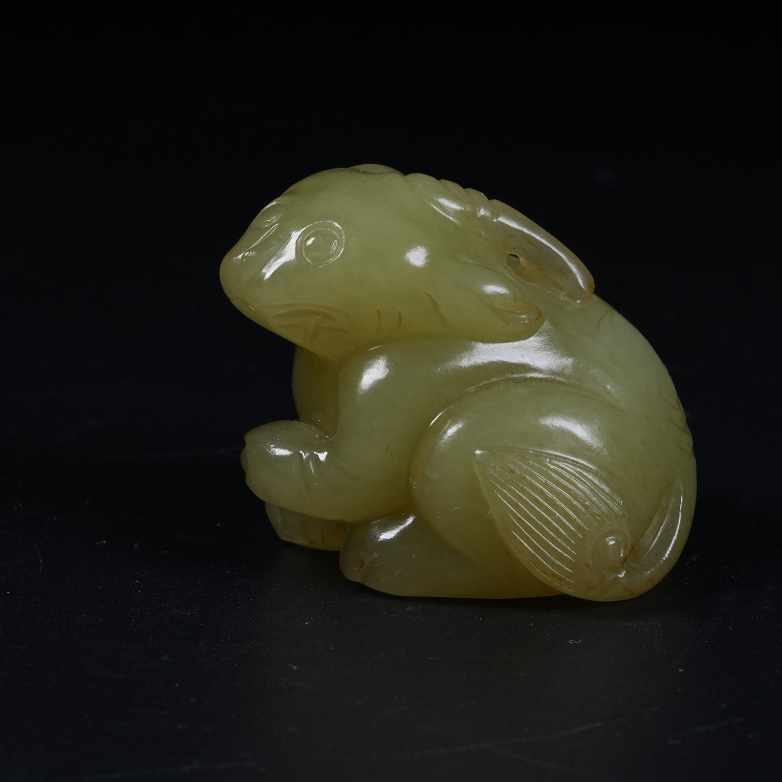 A HETIAN TOPAZ AUSPICIOUS BEAST ORNAMENT: Hetian Topaz Auspicious Beast Ornament