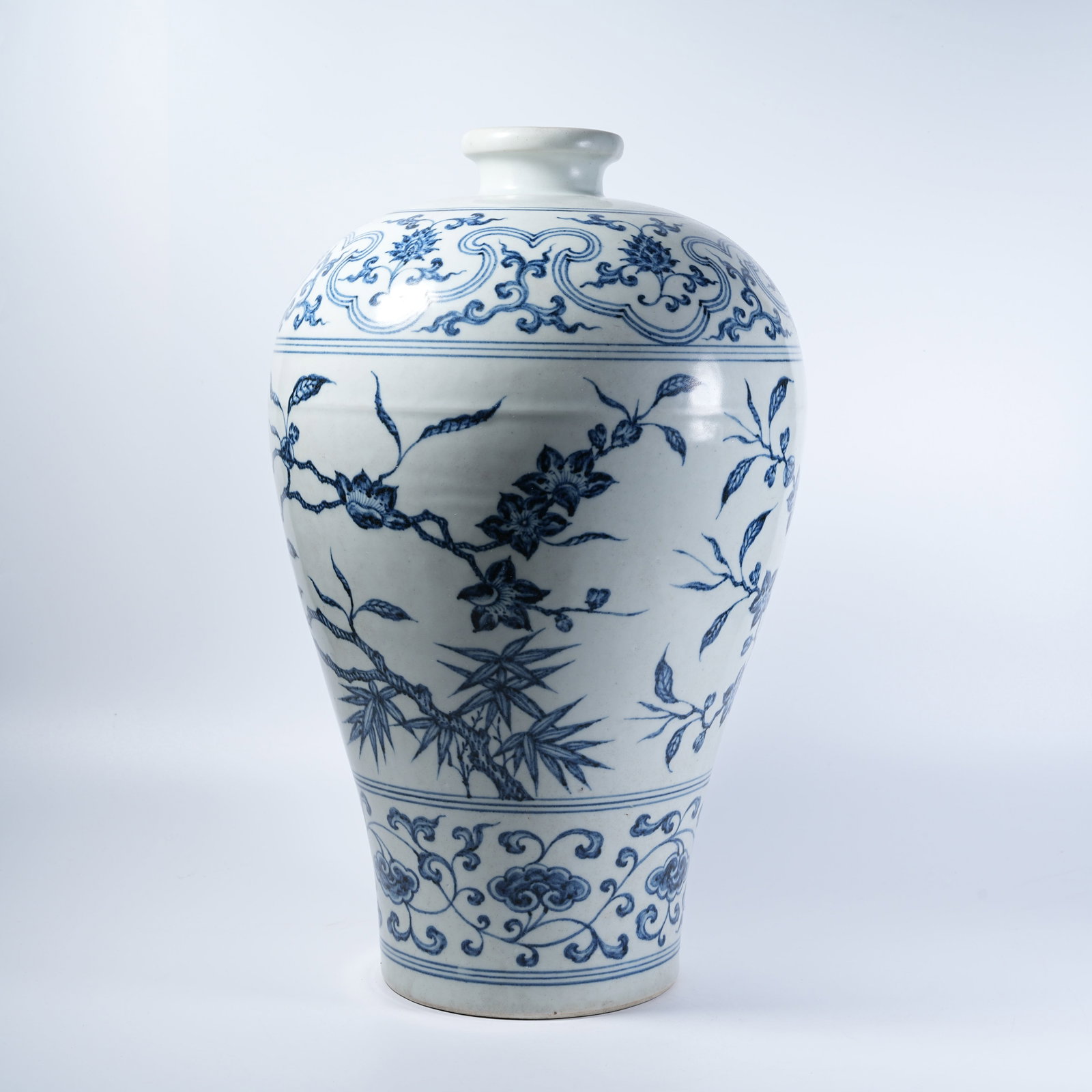 A PLUM VASE WITH BLUE AND WHITE FLORAL AND AUSPICIOUS FRUIT PATTERNS: Plum Vase with Blue and White Floral and Auspicious Fruit Patterns