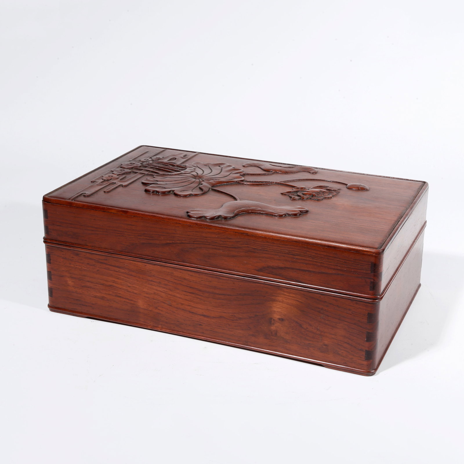 A HUANGHUALI WOOD CARVED COVERED BOX WITH LOTUS PATTERN: Huanghuali Wood Carved Covered Box with Lotus Pattern