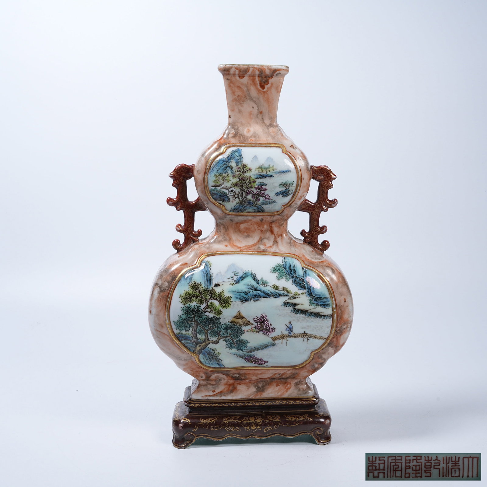 A DISC VASE WITH WINDOWED FAMILLE ROSE LANDSCAPE AND FIGURE SCENES ON STONE-GRAIN GLAZE: Disc Vase with Windowed Famille Rose Landscape and Figure Scenes on Stone-Grain Glaze