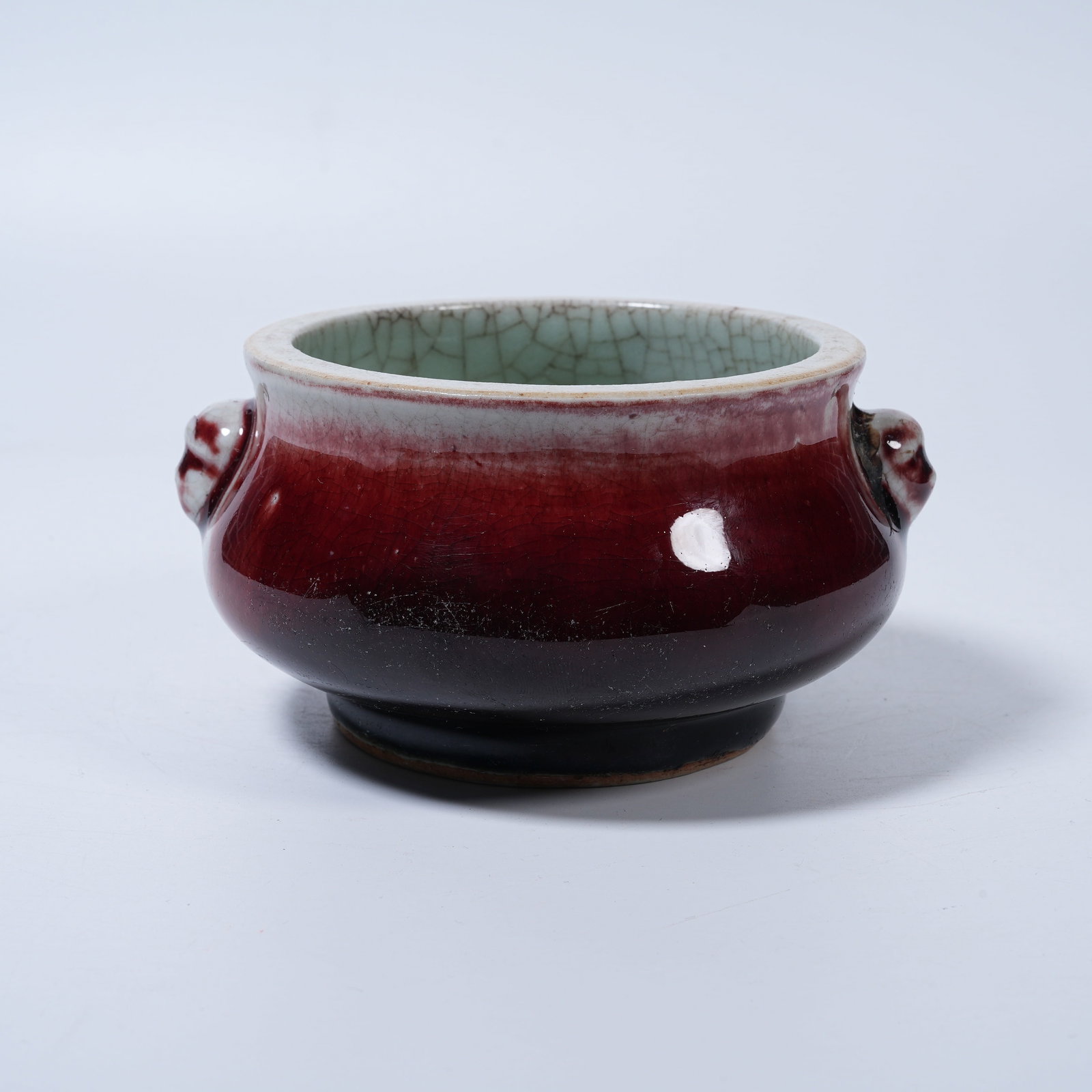 A LANGYAO RED GLAZE CENSER WITH BEAST EARS: Langyao Red Glaze Censer with Beast Ears