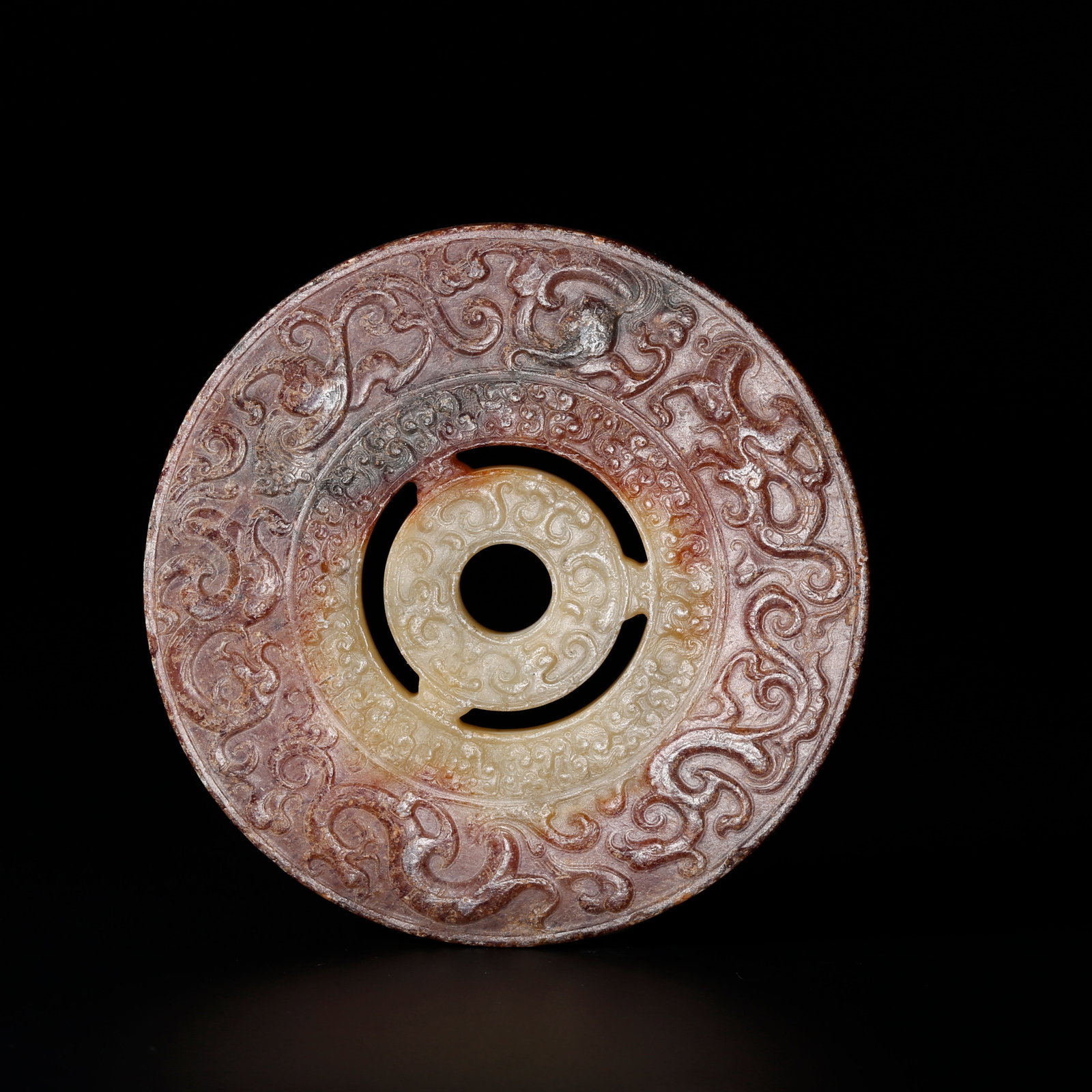A ANCIENT JADE BI DISC CARVED WITH BEAST MOTIFS: Ancient Jade Bi Disc Carved with Beast Motifs