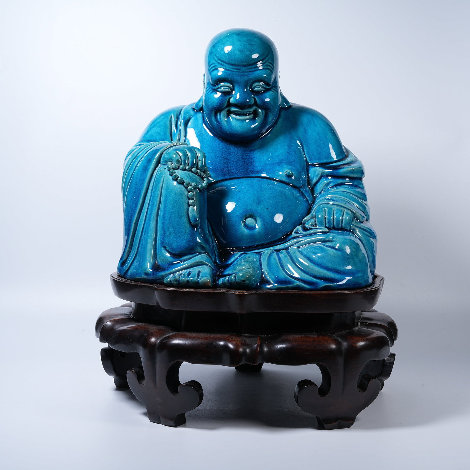 A PEACOCK BLUE GLAZE SEATED MAITREYA STATUE (1 of 8)