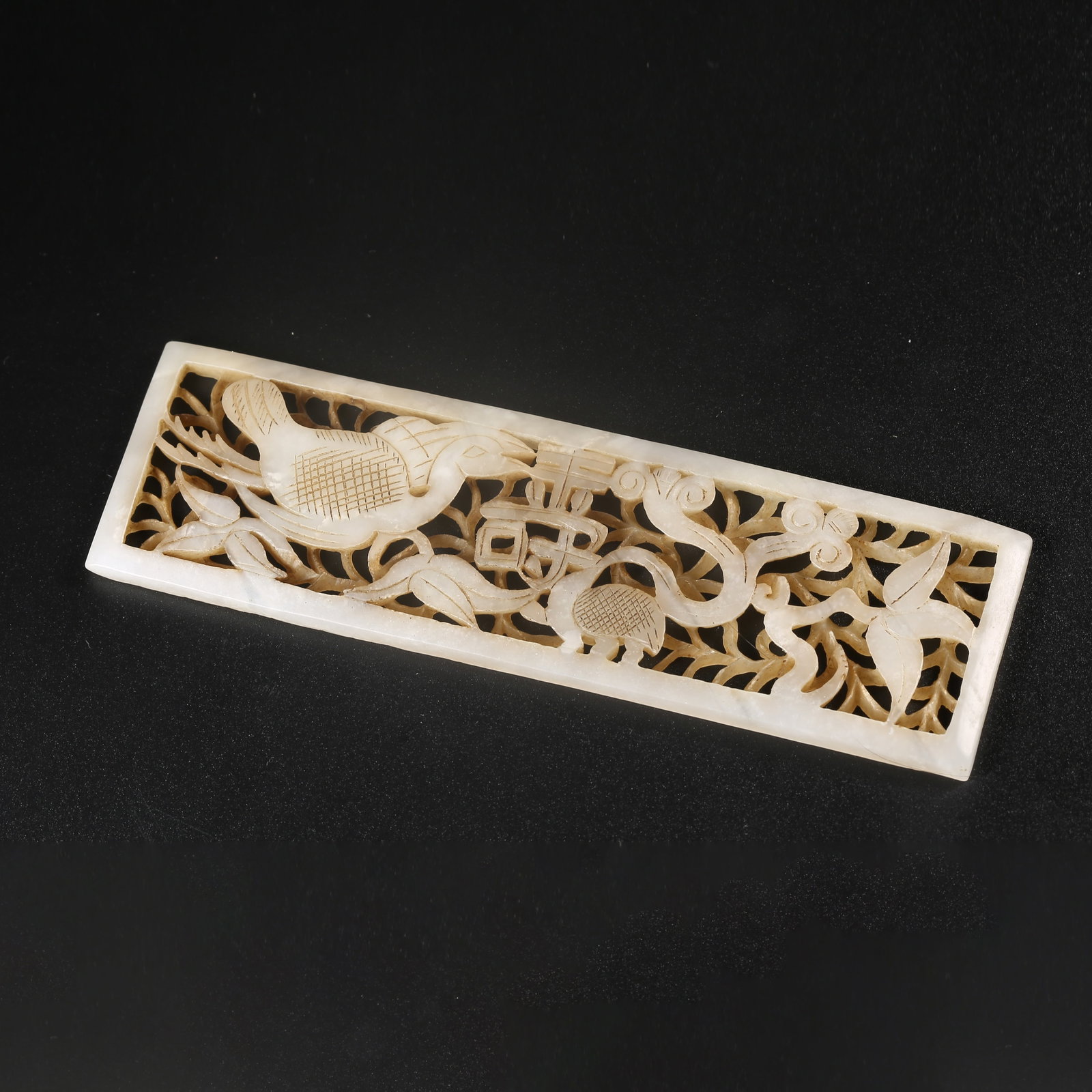 A HETIAN JADE DECORATIVE PANEL CARVED WITH A PHOENIX AMID FLOWERS (1 of 9)