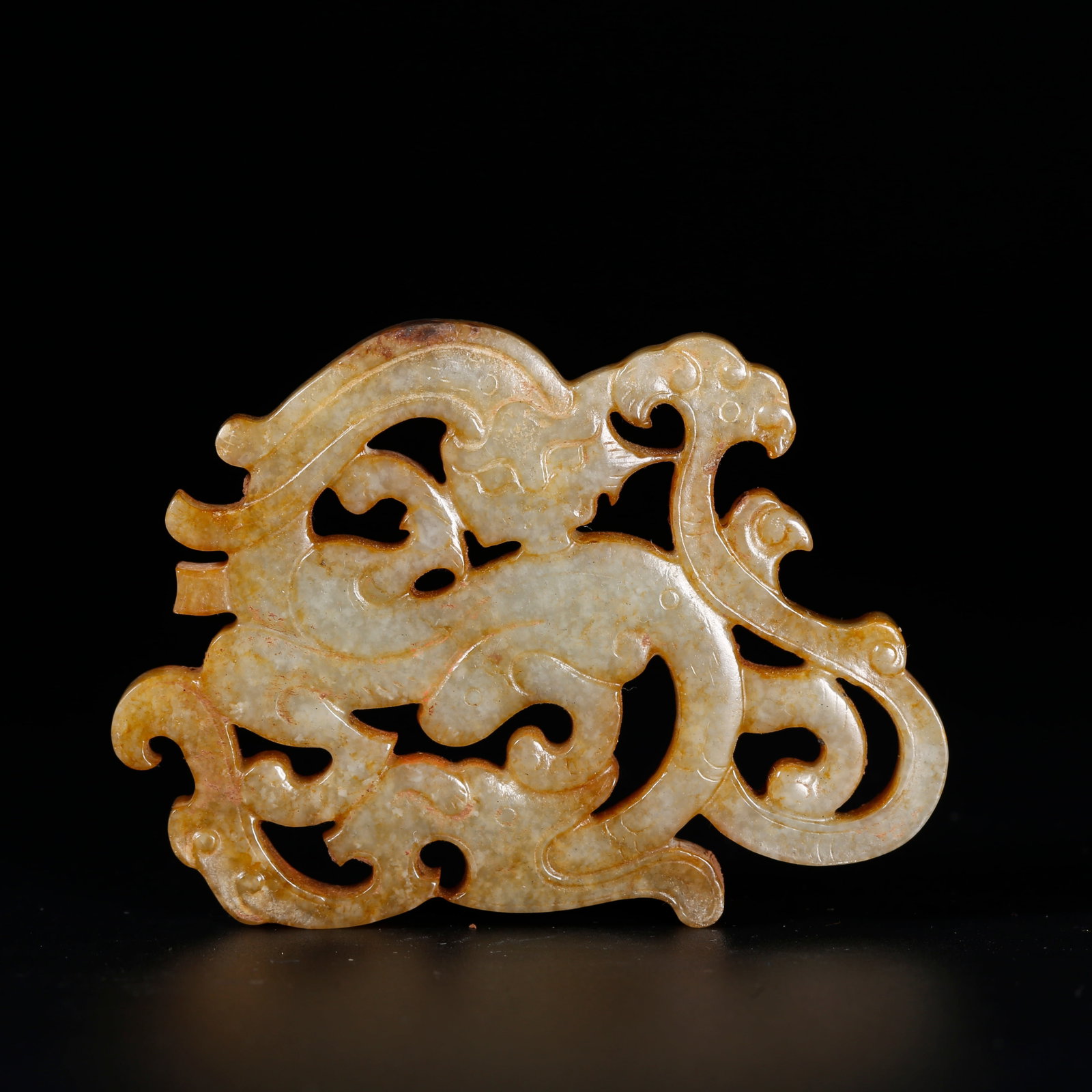 A ANCIENT JADE PENDANT CARVED WITH DRAGON MOTIFS: Ancient Jade Pendant Carved with Dragon Motifs