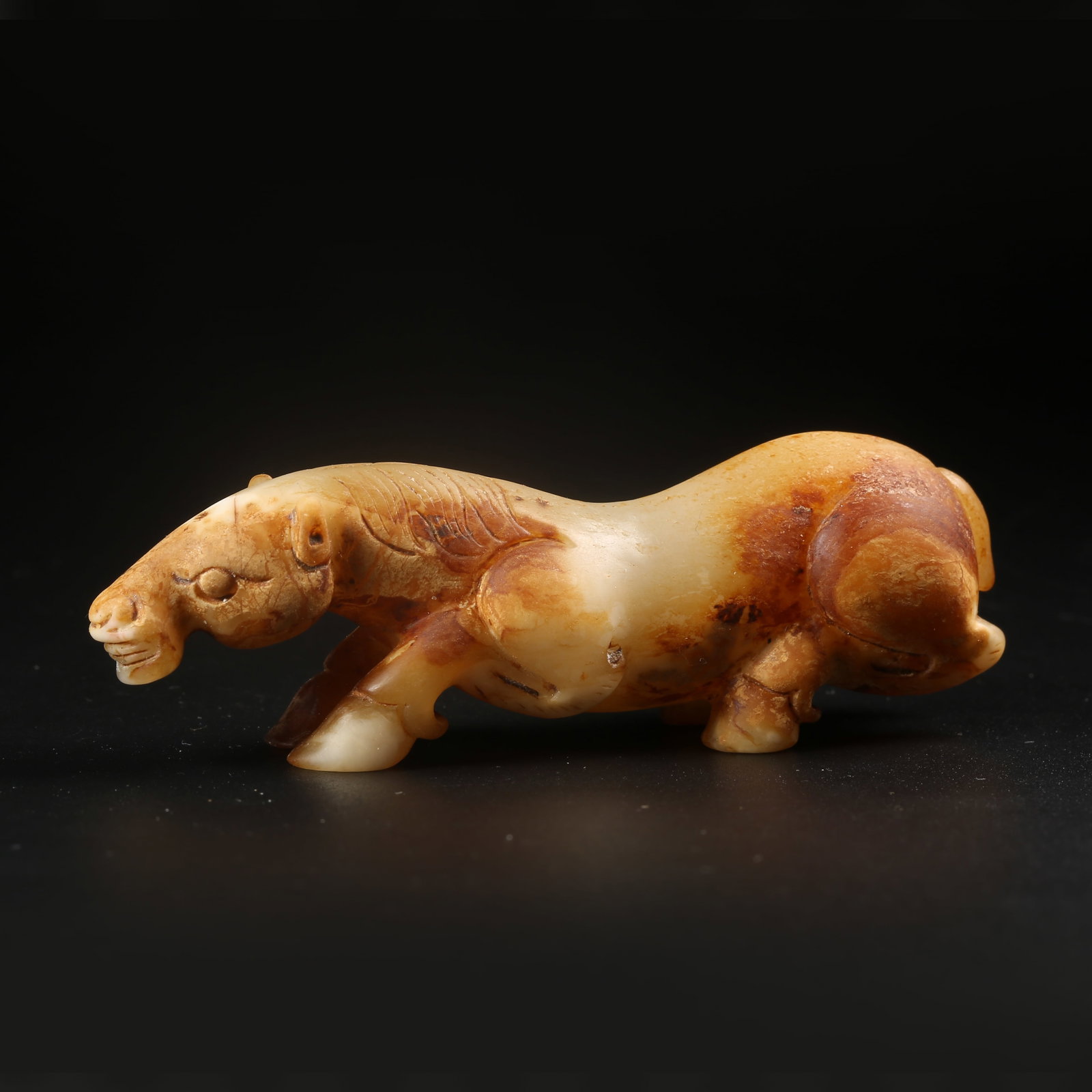 A ARCHAIC JADE RECUMBENT HORSE: Archaic jade recumbent horse
