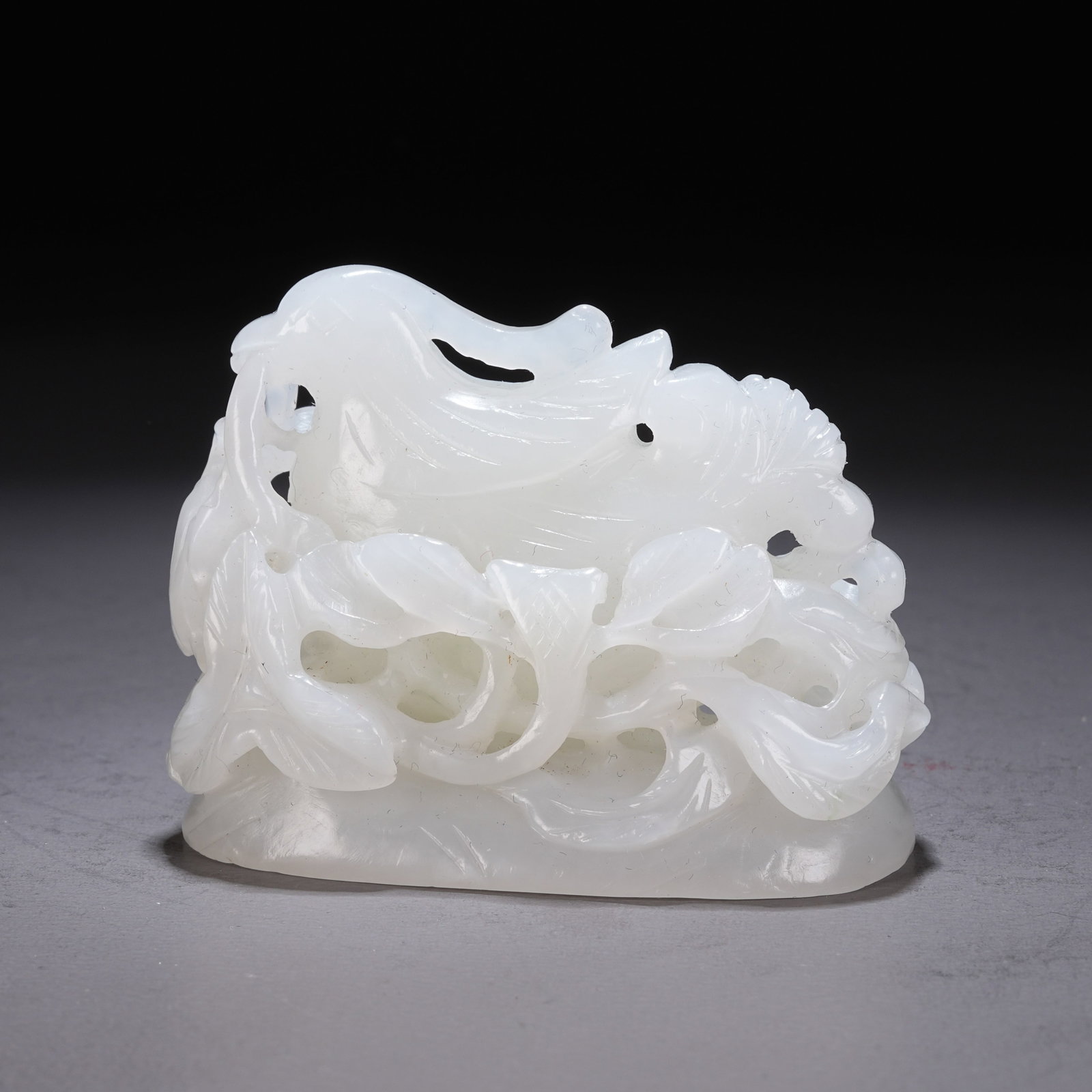 A HETIAN WHITE JADE INCENSE BURNER WITH PHOENIX AND FLORAL SCROLL MOTIFS: Hetian White Jade Incense Burner with Phoenix and Floral Scroll Motifs