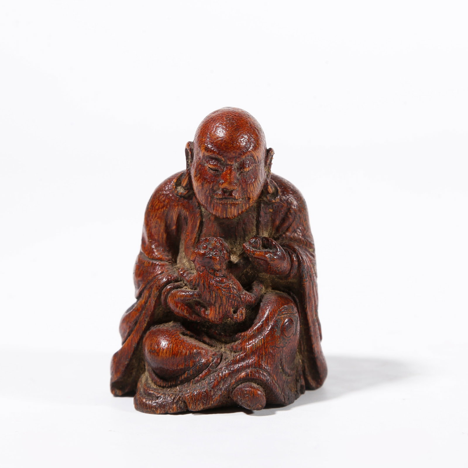 A BAMBOO ROOT CARVED ARHAT ORNAMENT (1 of 8)