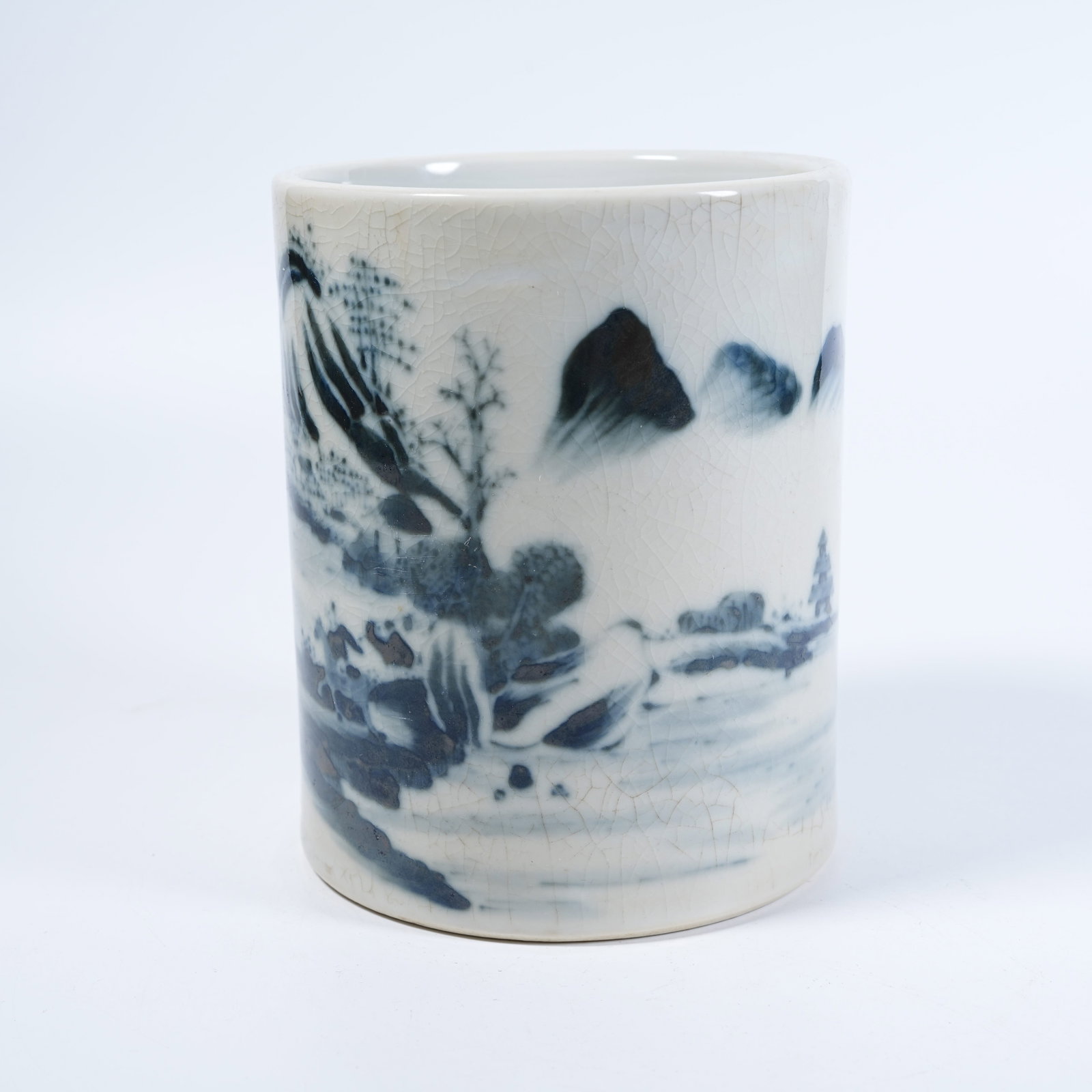 A BRUSH POT WITH BLUE AND WHITE LANDSCAPE AND FIGURE MOTIFS (1 of 9)