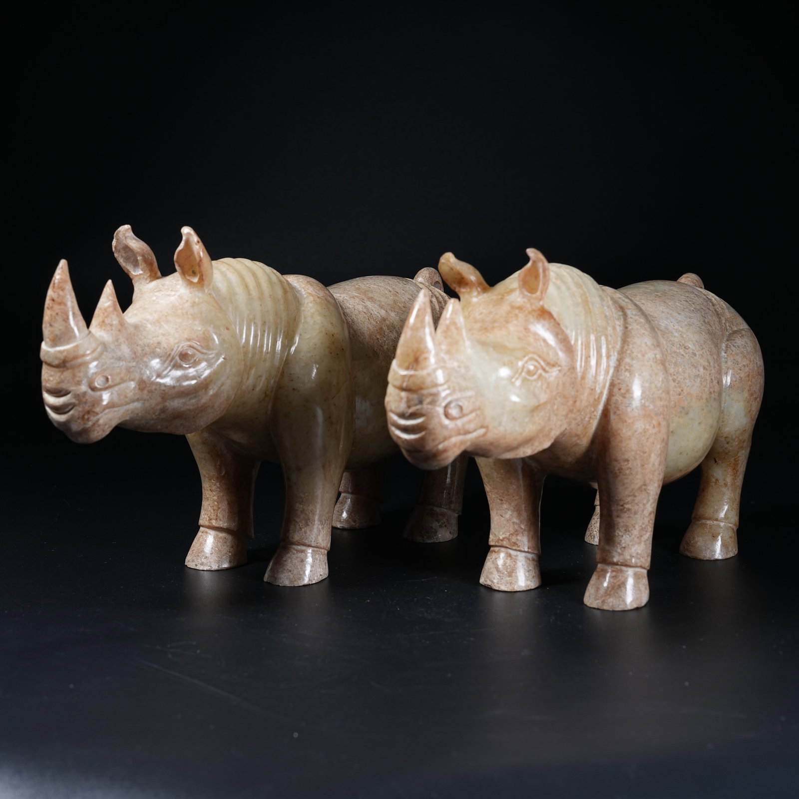 A SET OF ANCIENT JADE RHINOCEROS FIGURINES (1 of 9)