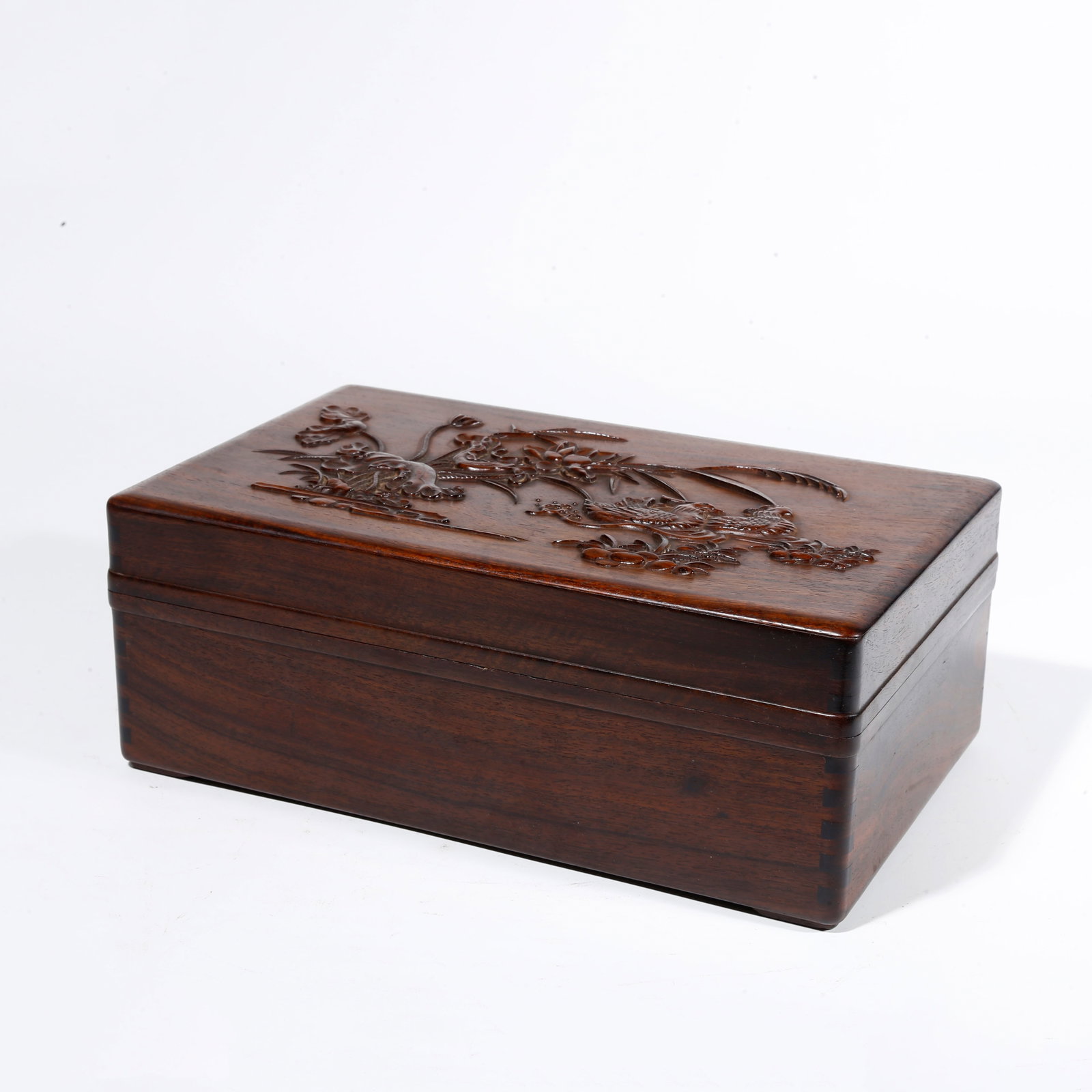 A HUANGHUALI WOOD CARVED COVERED BOX WITH FLOWER AND BIRD PATTERN: Huanghuali Wood Carved Covered Box with Flower and Bird Pattern