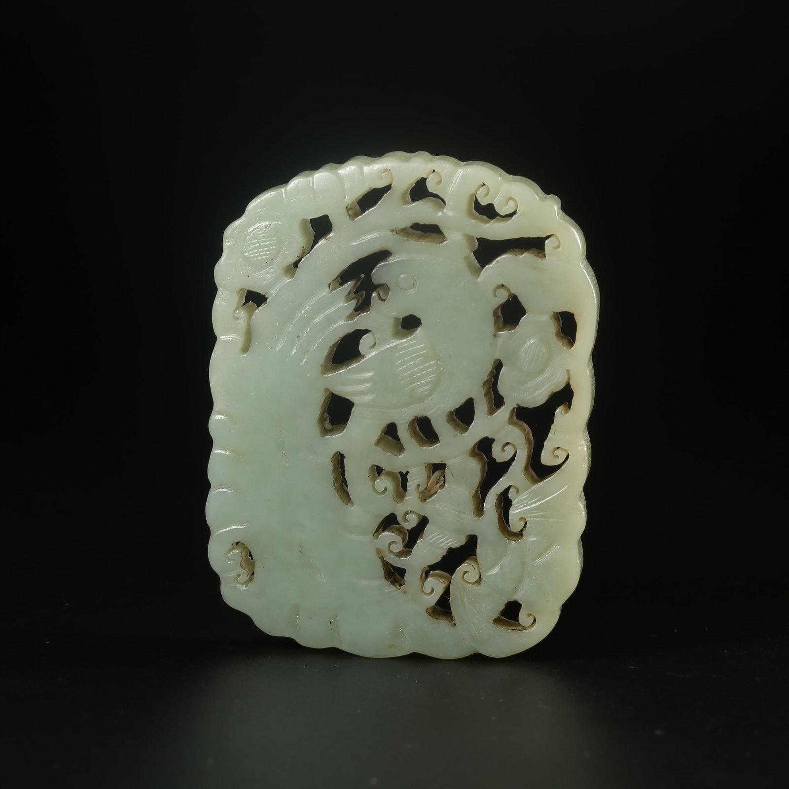 A HETIAN JADE PENDANT CARVED WITH AUSPICIOUS PHOENIX MOTIFS (1 of 8)