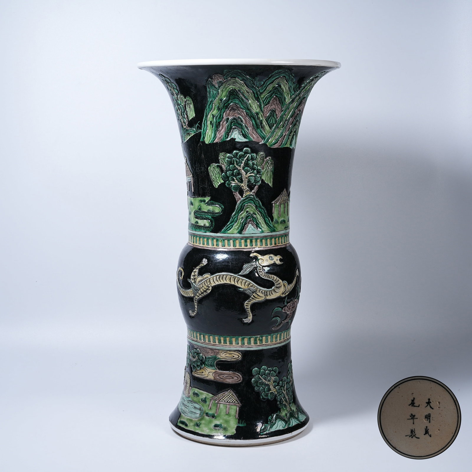 A PLAIN TRICOLOR CARVED PORCELAIN GU VASE WITH LANDSCAPE AND DRAGON PATTERNS (1 of 9)